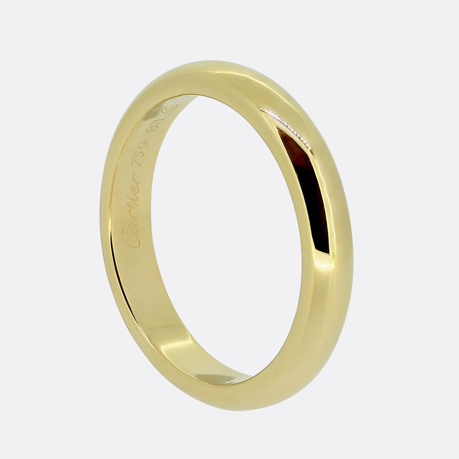 This is a plain 18ct yellow gold D-shaped wedding band from the world renowned jewellery house of Cartier. The band is 4mm in width and is totally unembellished providing a sleek, classic look. It forms part of the 1895 collection.

Condition: Used