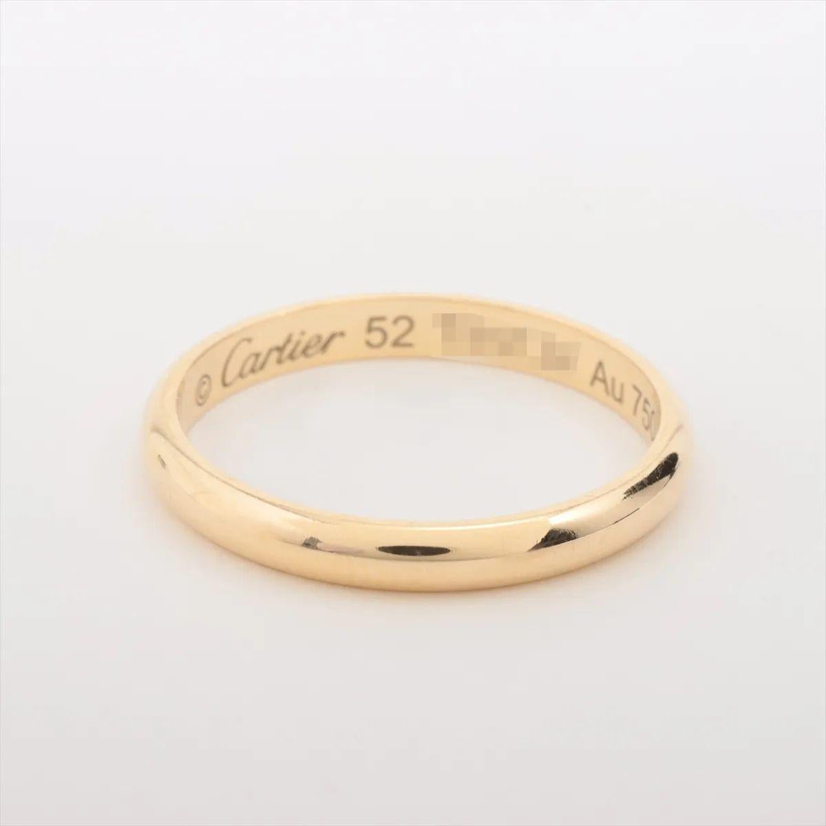 The Cartier 1895 Wedding Ring in yellow gold is a classic and elegant expression of timeless love. Crafted from radiant 18k yellow gold, the iconic band features a smooth, polished finish and a refined, minimalist design that reflects Cartier’s