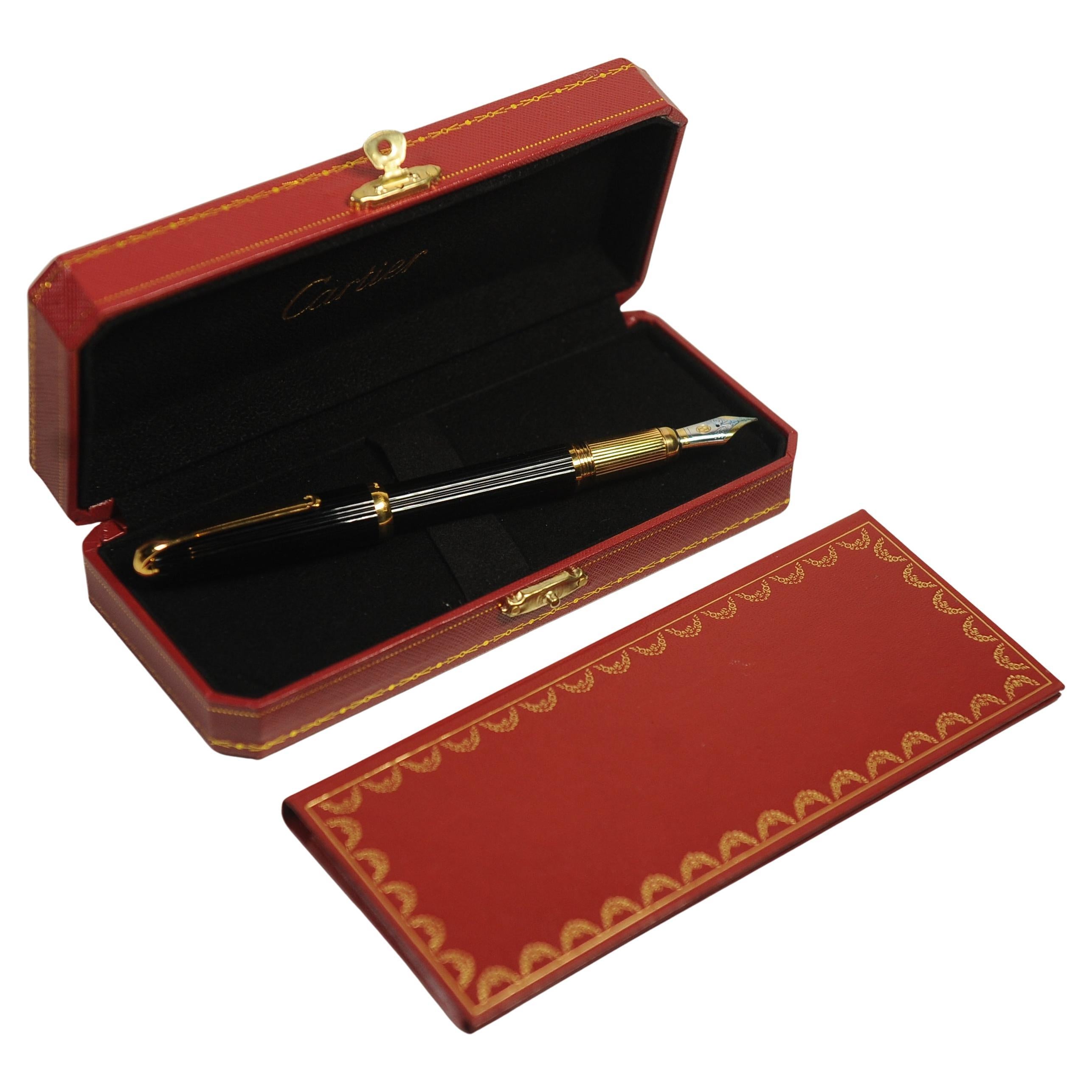 Cartier 18ct Gold Nib Louis Black Godron Ribbed Fountain Pen With Cartier Box, Finished With An Onyx Cabochon

Manufactured by Montblanc

The pen is made from a black composite
Pen nib is 18K Yellow Gold Stamped 750     
Pen Serial Ref 035806    