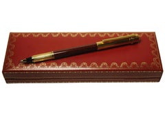 Penna roller Cartier Trinity con pennino in oro 18 ct e lacca di Borgogna