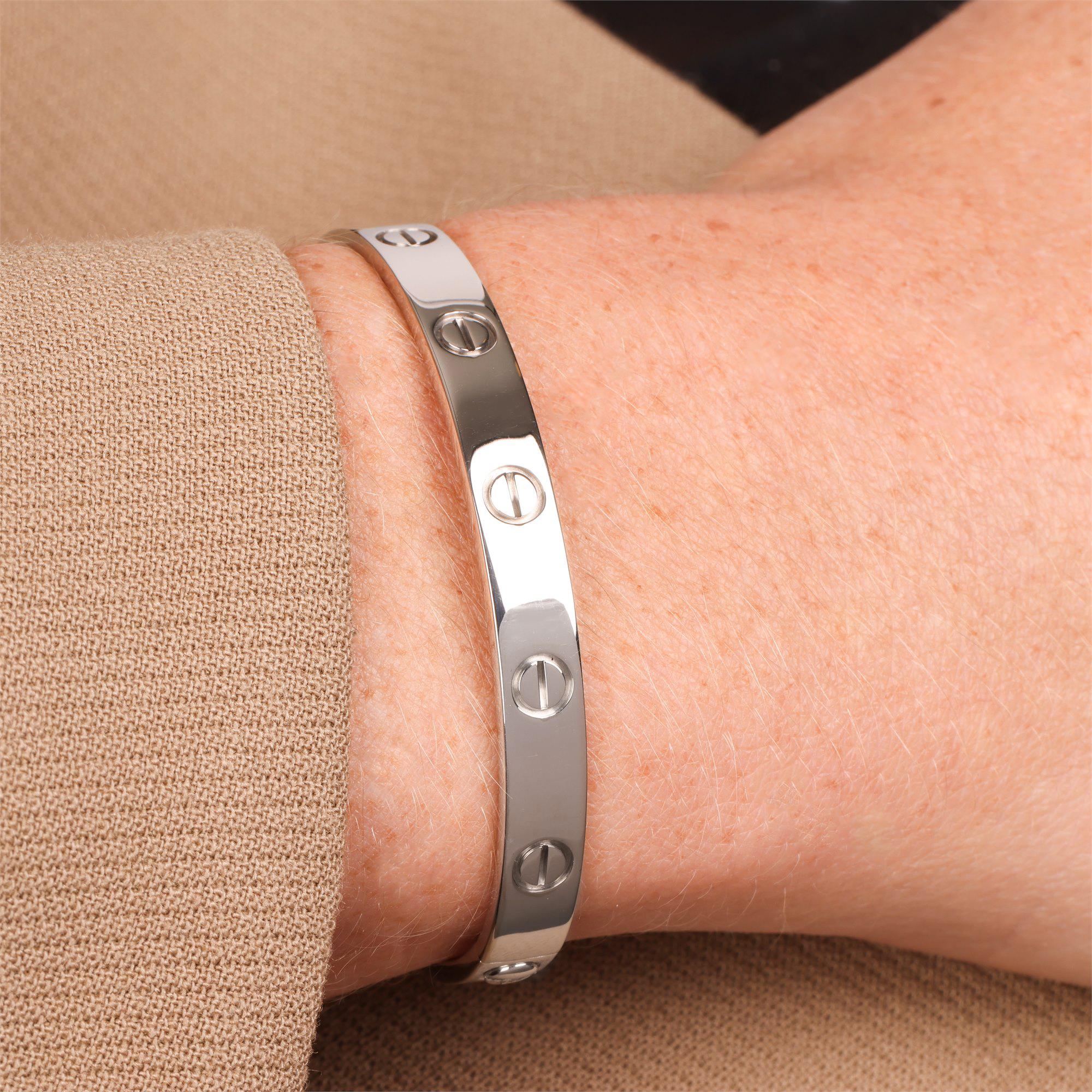 Cartier 18ct White Gold Love Bangle

Product Details
Xupes Ref: J1085
Brand: Cartier
Model: Love Bangle
Type: Bracelet
Serial Number: E*****
RRP: £7,550
Accompanied By: Cartier Pouch, Service Papers, Screwdriver
Material(s): 18ct White