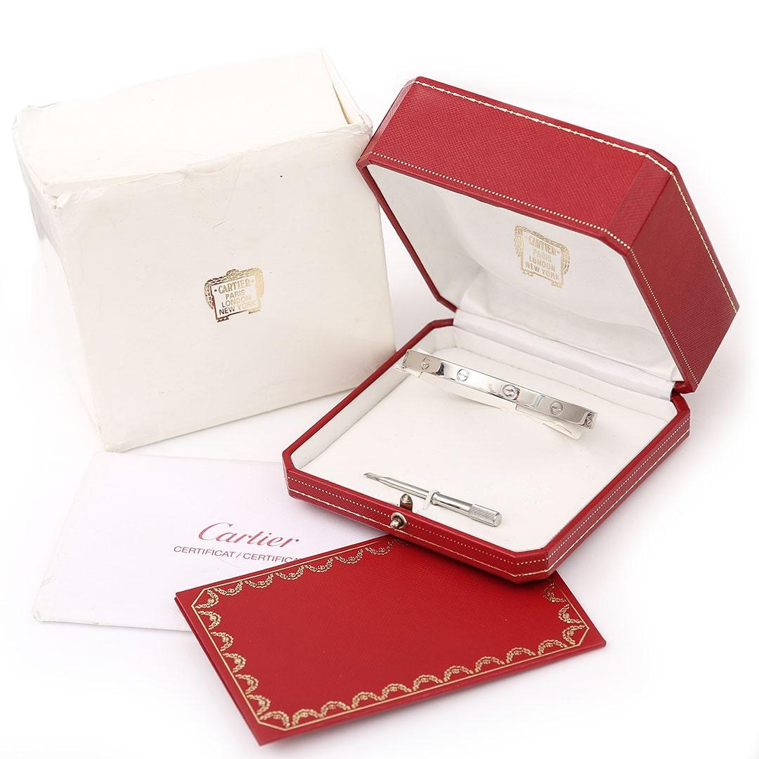 An iconic original Cartier ‘Love’ bangle set in 18ct white gold dating from circa 1993 (size 21) with its original box, screwdriver and Cartier receipt - the perfect full set! Cartier's Love collection is the epitome of iconic, from the recognisable