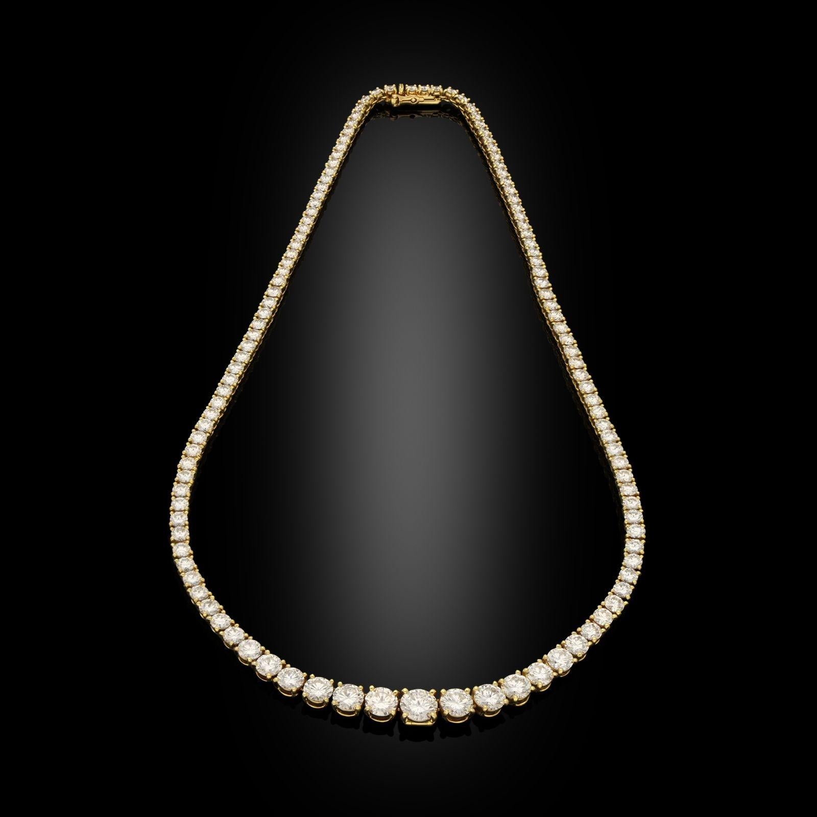 A classic 'Tennis' 18ct gold and diamond line riviere necklace by Cartier c.2006, the necklace of tapering form composed of one hundred and nineteen graduated round brilliant cut diamonds weighing 16.50cts in total, all claw set in 18ct yellow gold