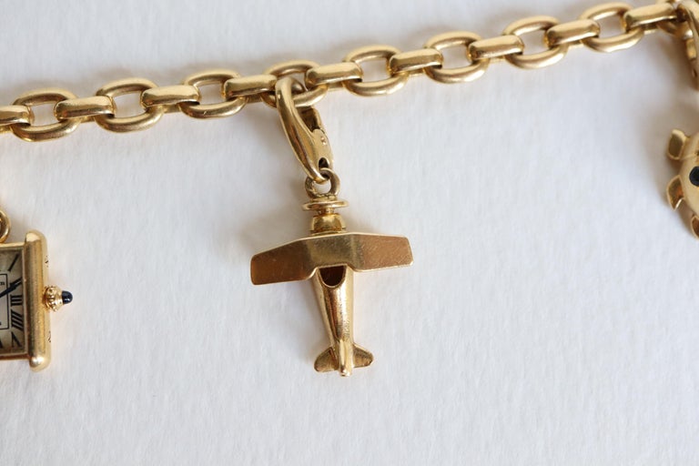 Cartier 18 Carat Yellow Gold Charm Bracelet For Sale at 1stdibs
