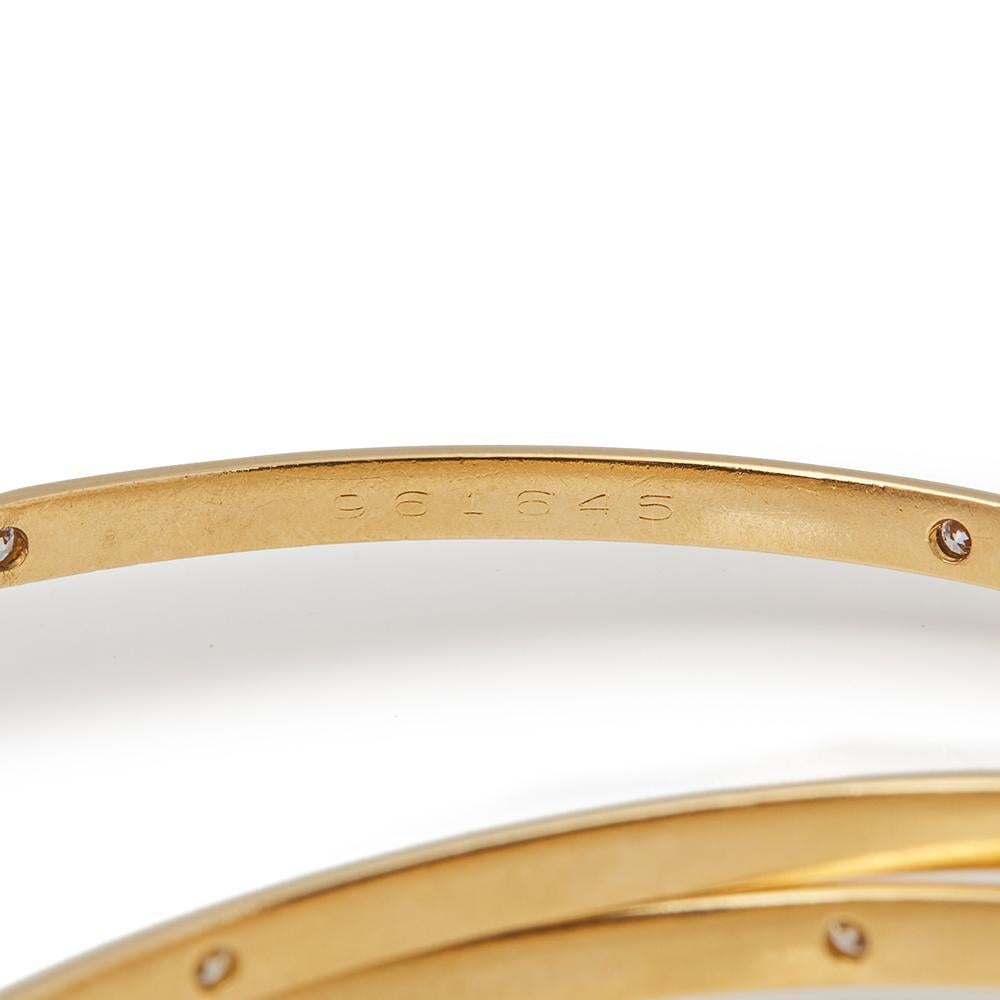 This bracelet by Cartier is from their Constellation Trinity collection and features round brilliant cut diamonds mounted in three 18ct yellow gold intertwined bangles. Complete with a Cartier pouch and certificate. Our Xupes reference is COMJ606