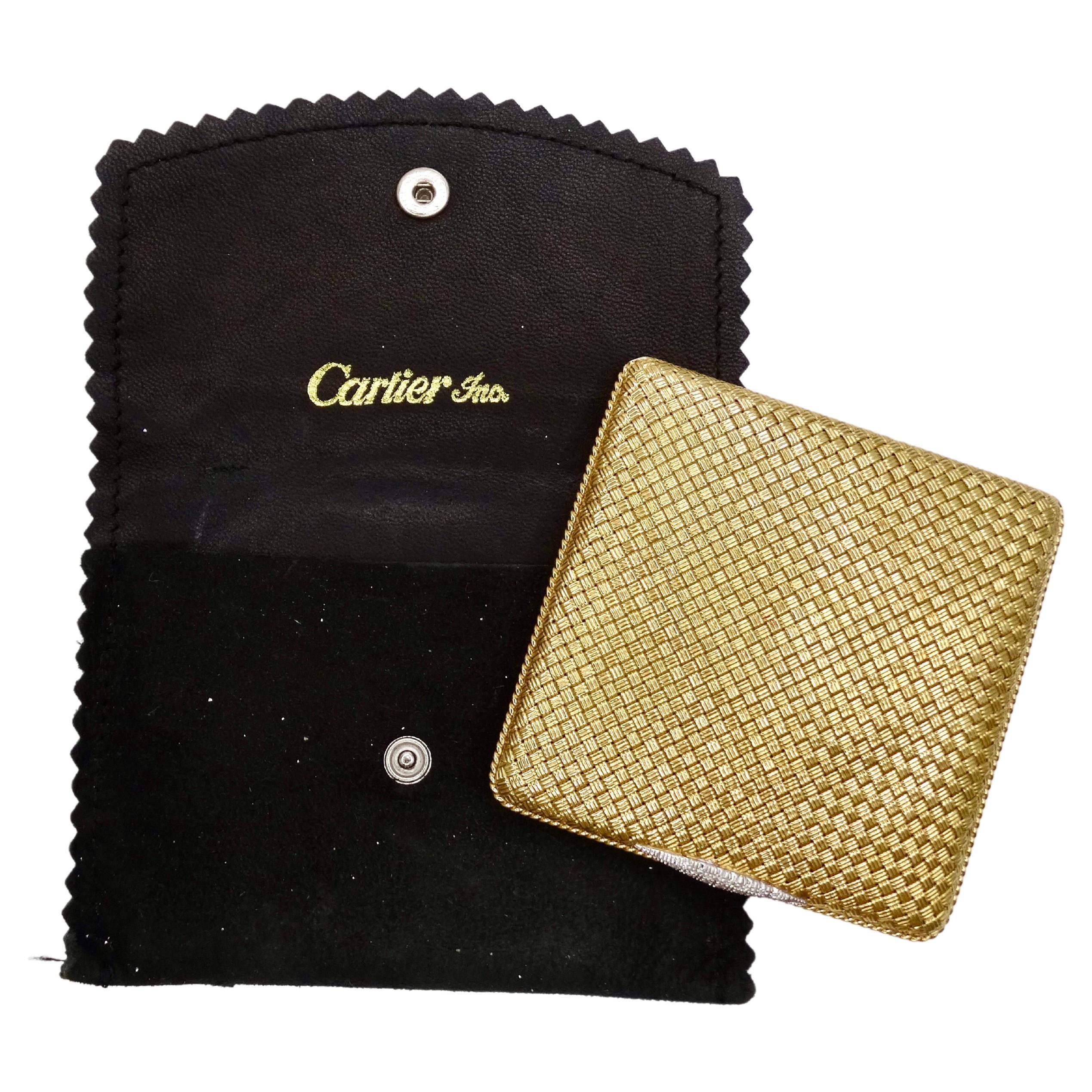 Vintage 18K yellow gold Cartier compact powder box with a woven texture and diamond encrusted thumb-piece. Circa 1950's. The compact is stamped with the maker's mark of 750. Weight: 153.89g grams Measurements: Width: 2.75 in (60 mm) Depth: 0.4 in