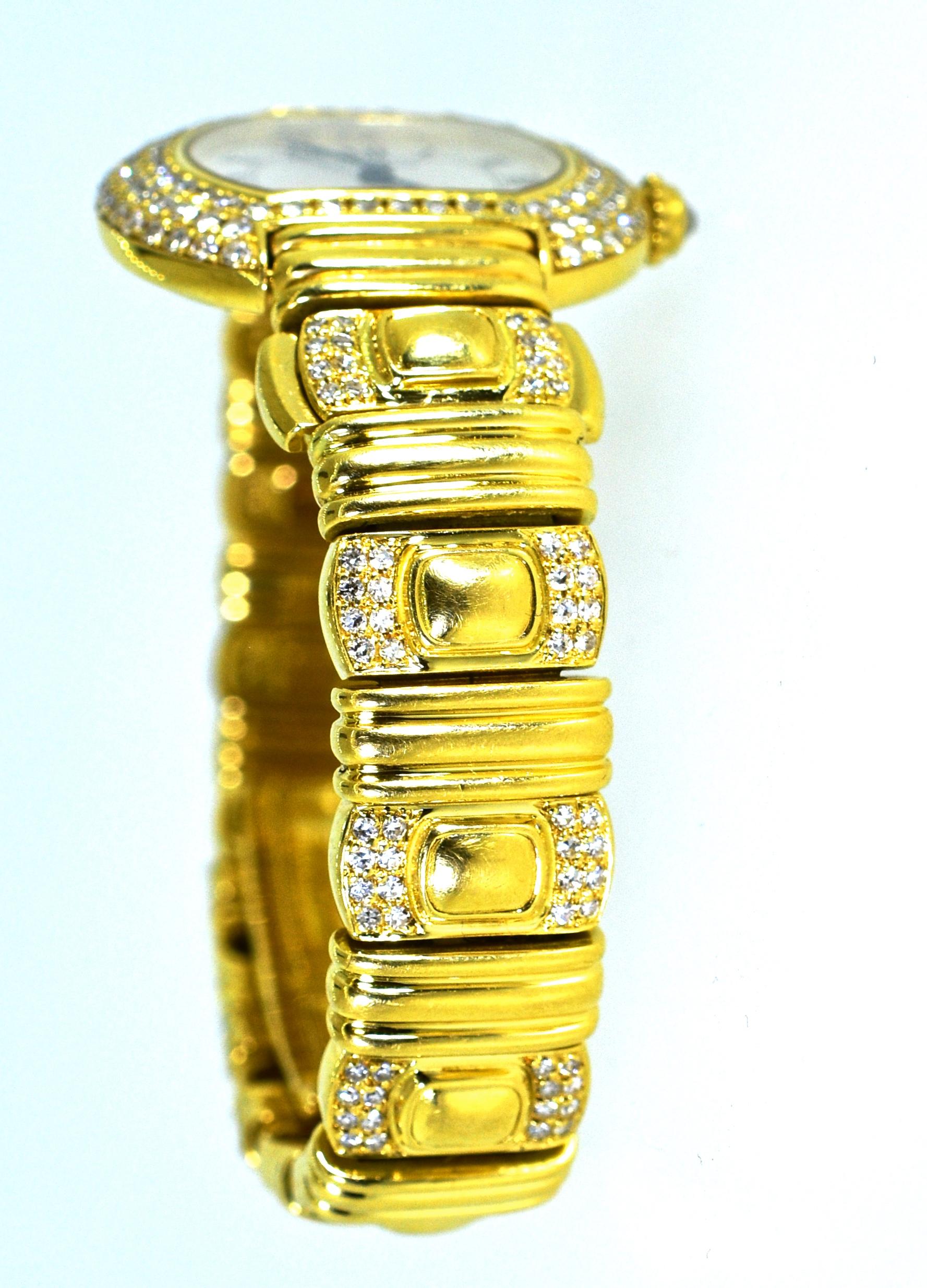 Cartier wristwatch or bracelet in 18K yellow gold with diamonds throughout, this watch bracelet can be worn with and without the watch.  Simply take out the watch and then put in the matching gold section and wear this piece just as a gold bracelet.