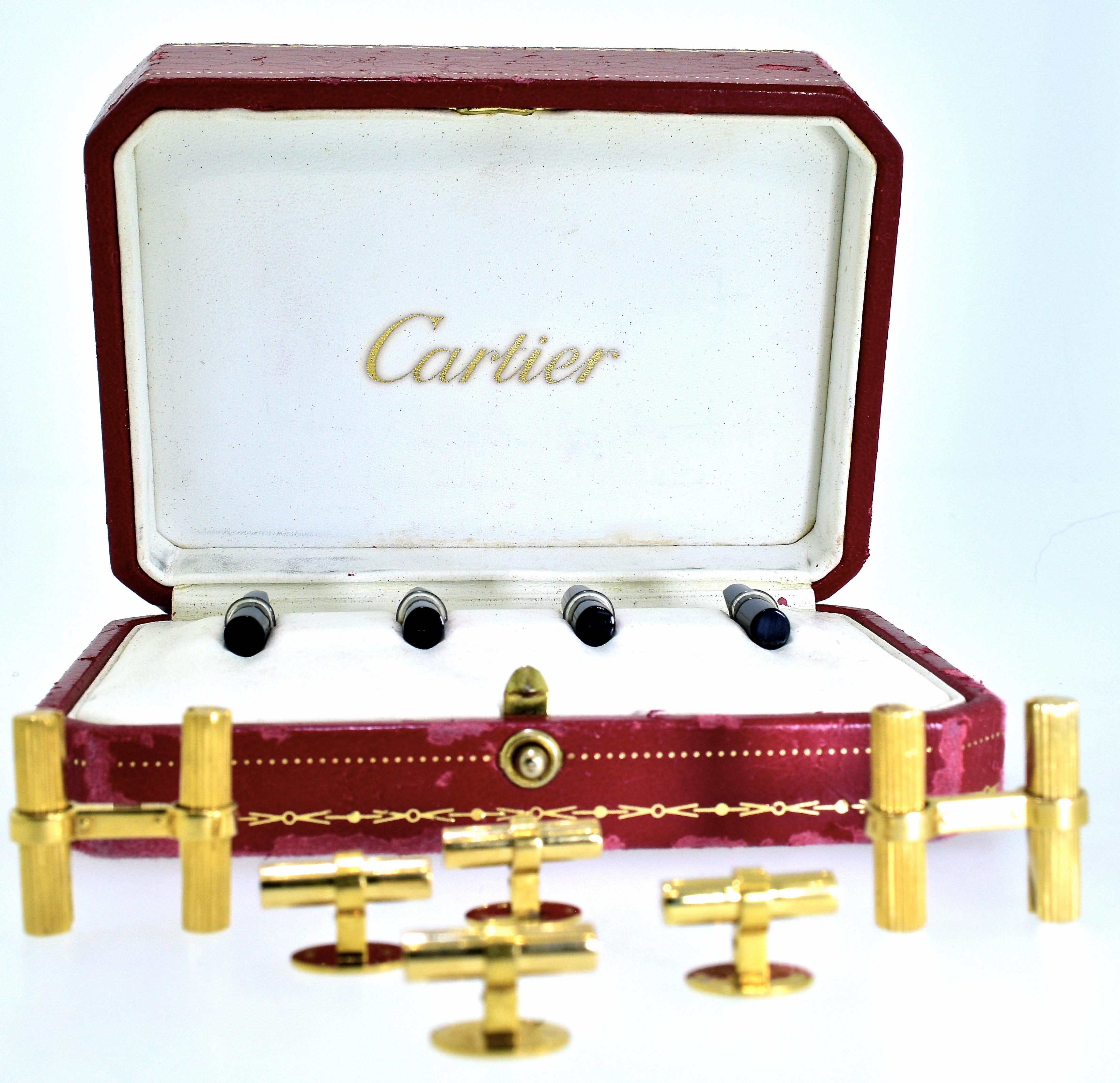 Cartier Paris 18K gold gentleman's dress set composed of cufflinks and shirt studs in gold batons which are  interchangeable with onyx batons and rock crystal batons.  Wear all gold, or all black onyx, or white rock crystal - or wear the different