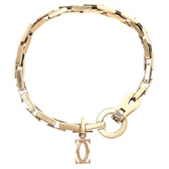 Cartier 18k Gold Agrafe Bracelet With Cartier Logo Charm