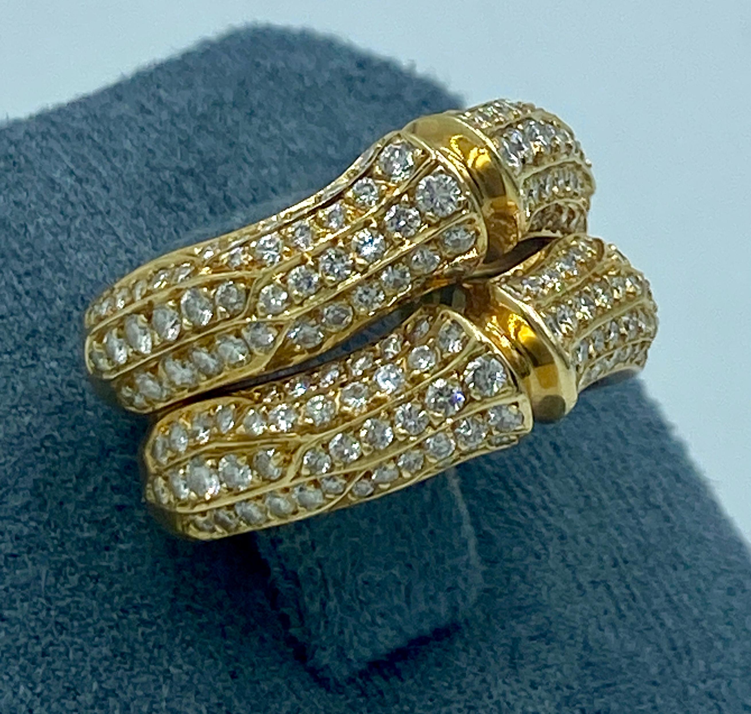 This striking 18k gold and diamond Cartier is in the style of a bamboo shoot. Made in 1990s it consists of 1.65 carats round cut white diamonds.