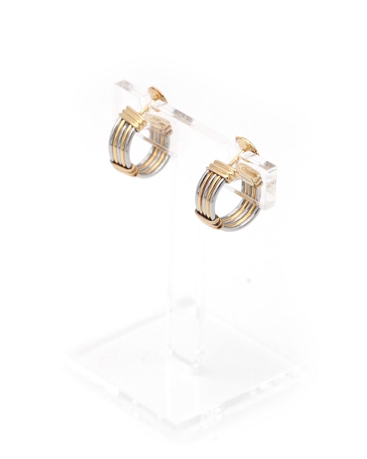 Contemporain Boucles d'oreilles Cartier en or 18 carats et acier signées et numérotées des années 80. en vente