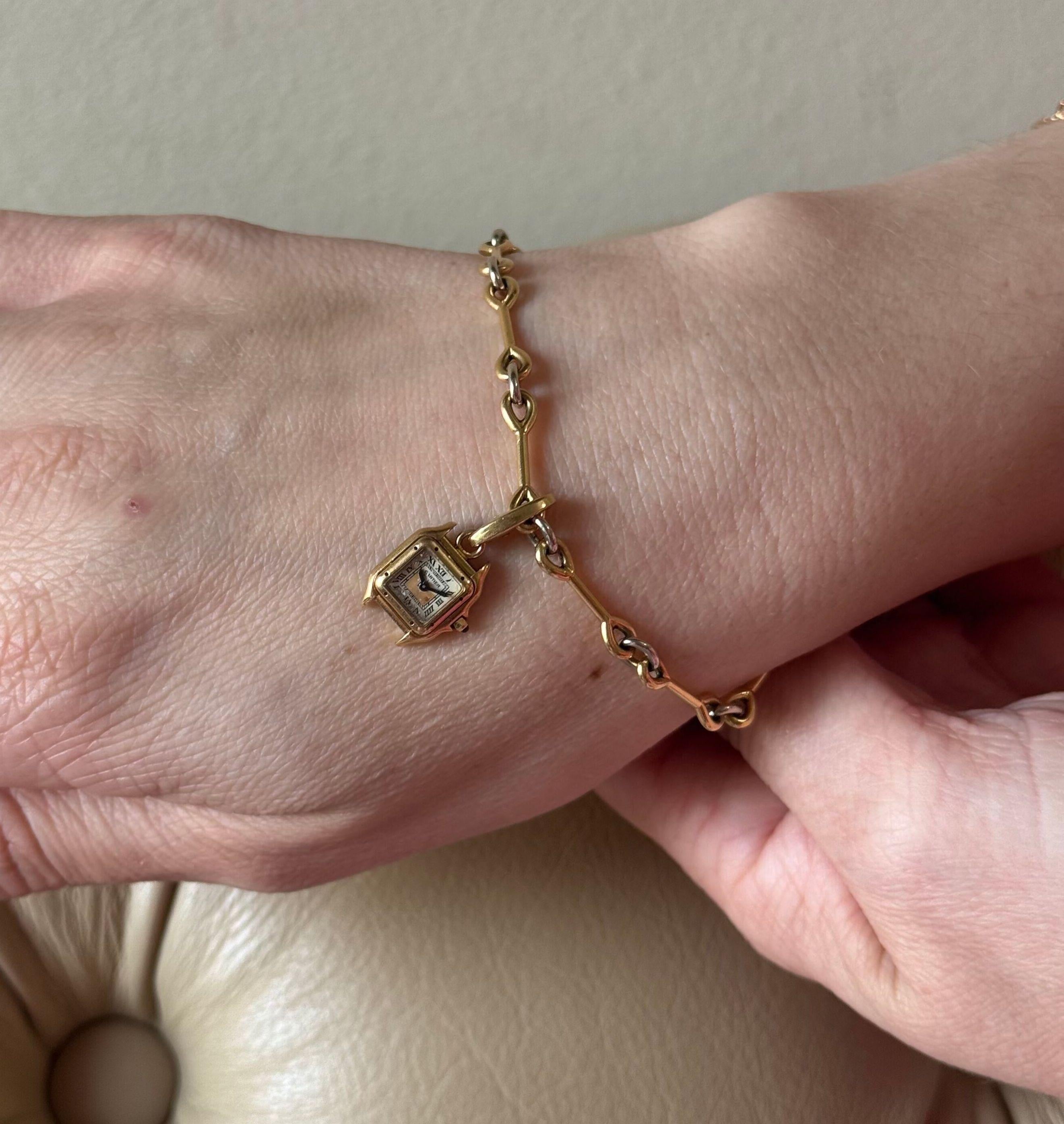 Pulsera Encanto Cruz y Reloj Santos Cartier de Oro de 18k y Diamantes en venta 3