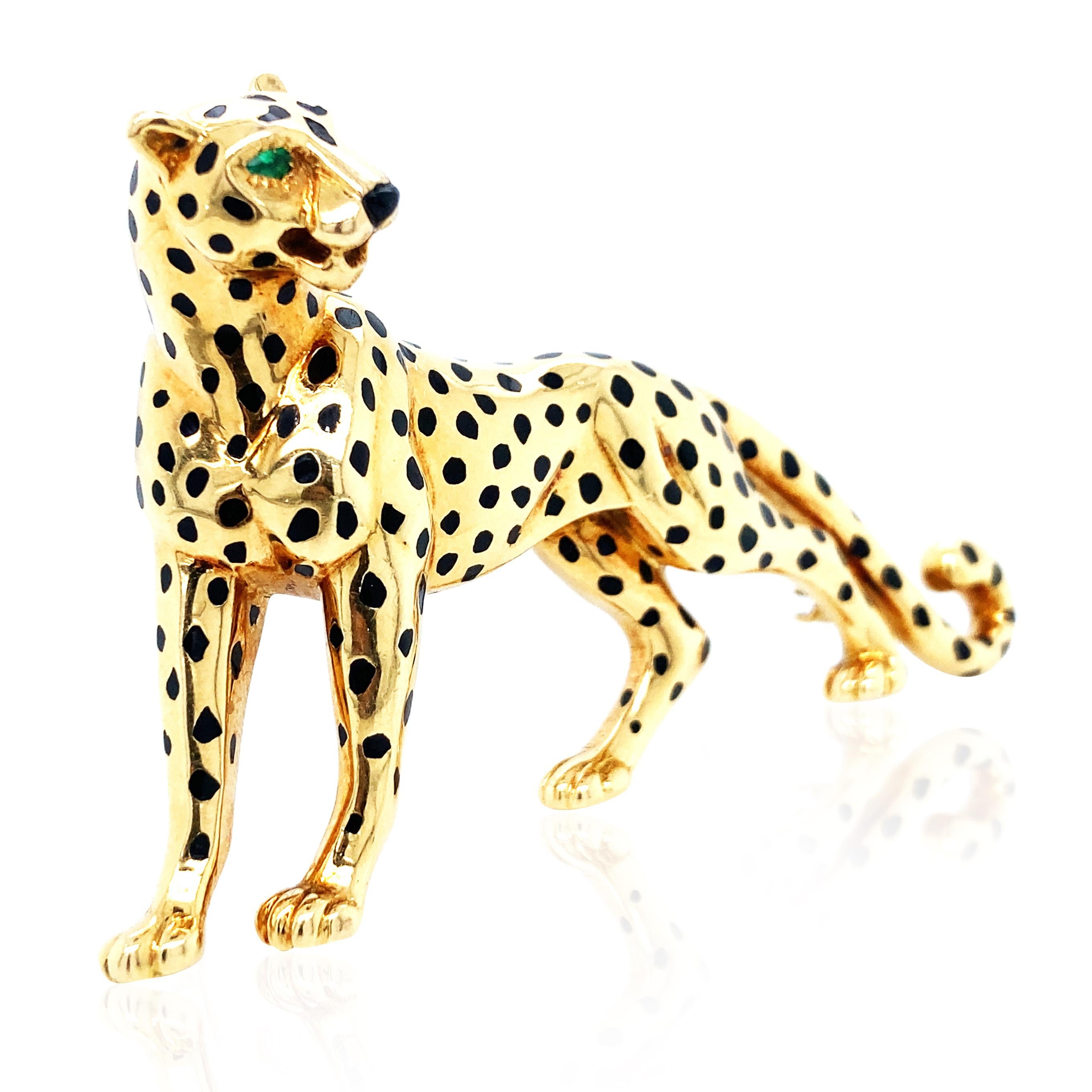 This Cartier panther brooch showcases exquisite gold craftsmanship, intricately sculpting the panther's poised muscles, capturing a dynamic and powerful presence. The vivid posture and fine detailing exemplify Cartier's superior artistry. Made of