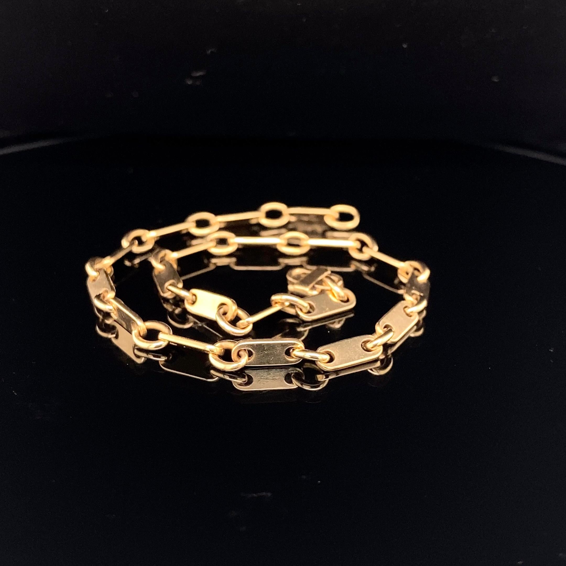 A fine Cartier Paris 18K gold link bracelet, 1960s

The bracelet is composed of tab links alternating with oval links, and closes with a fancy clasp; 

signed Cartier Paris, numbered 11715, marked 750 and with Cartier maker's mark and French assay