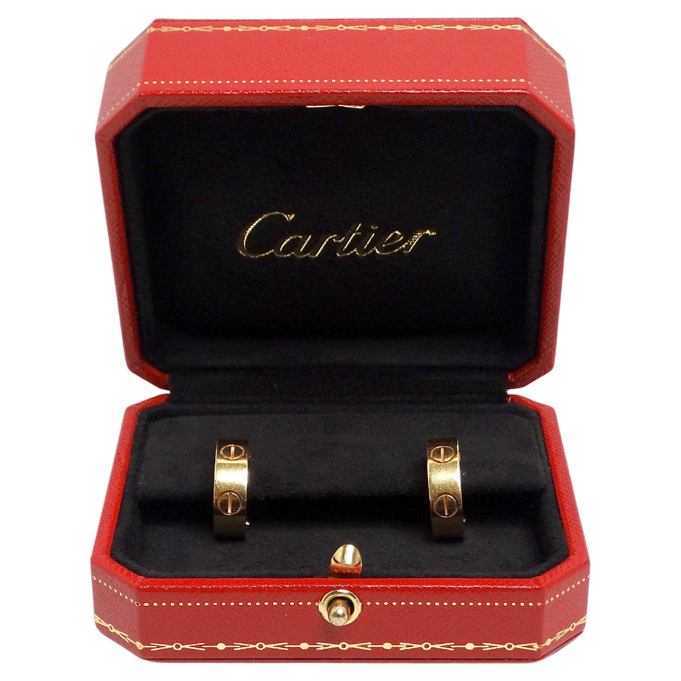 The Cartier 18k Gold Love Earrings epitomize timeless elegance and sophistication. Crafted from luxurious 18k yellow gold, these earrings feature the iconic screw motif, symbolizing enduring love and commitment. Their delicate design ensures a