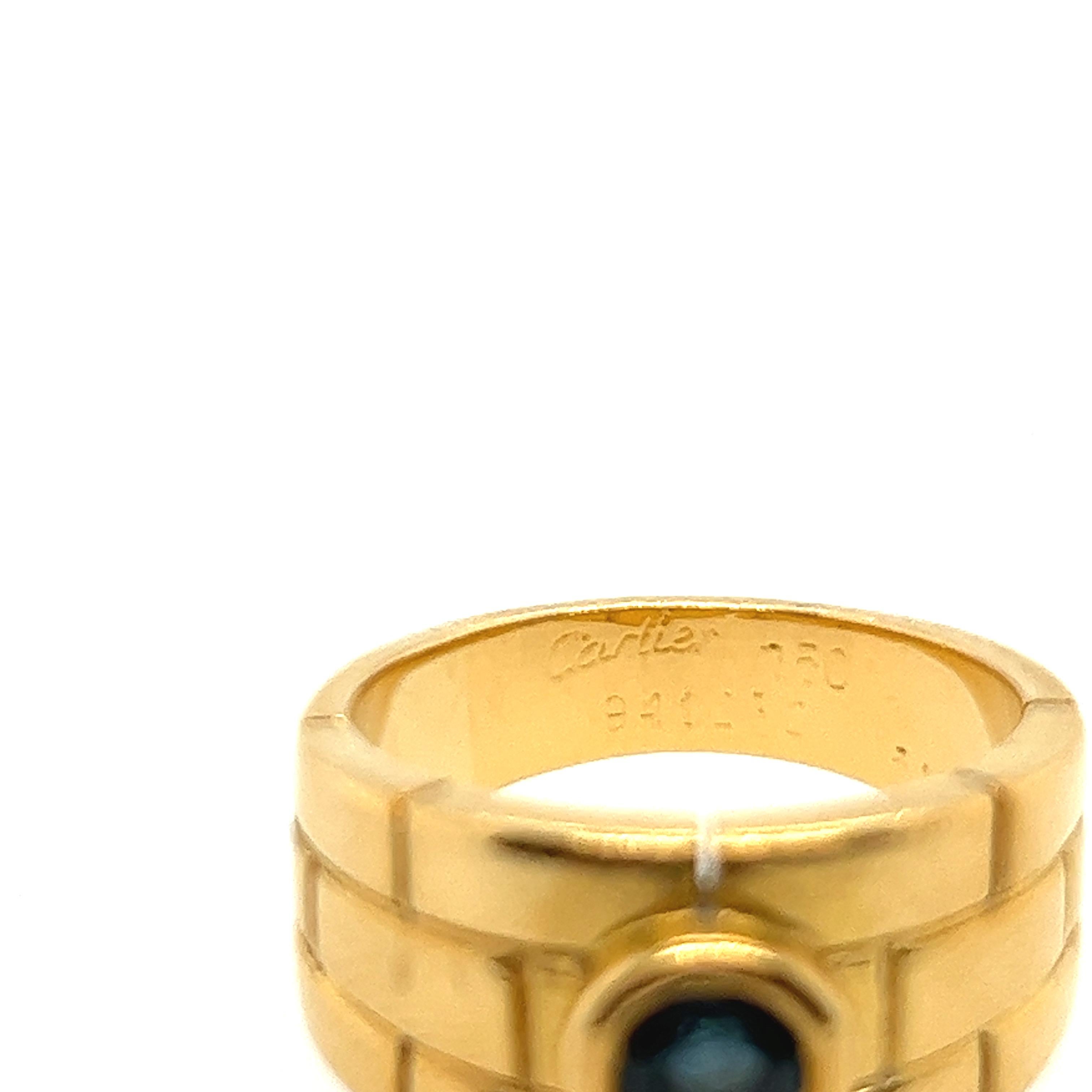 Cartier is known for their unique collections and classic pieces. From the panthers collection comes this carved brick pattern 18 k yellow gold band. Nestled in the centre is a beautiful blue sapphire. Ref # B4001400
Comes in original box.