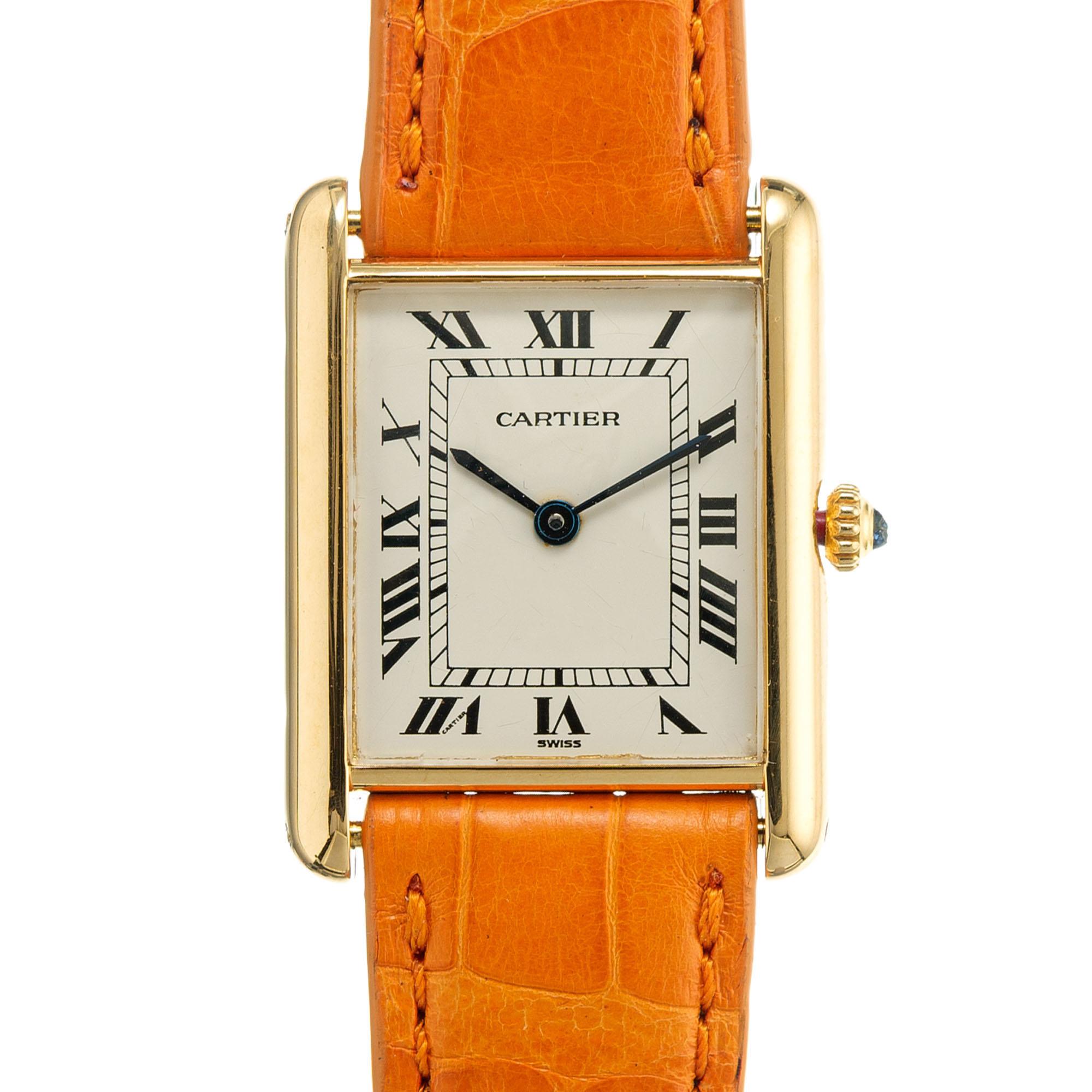 Cartier tank quartz ladies wristwatch. Parchment dial. Sapphire dial. Cartier strap and 18k yellow gold Cartier buckle. Complete service

26.8 grams
Length: 30.53mm
Width: 23.45mm
Band width at case: 17.55mm
Case thickness: 6.03mm
Band: Genuine