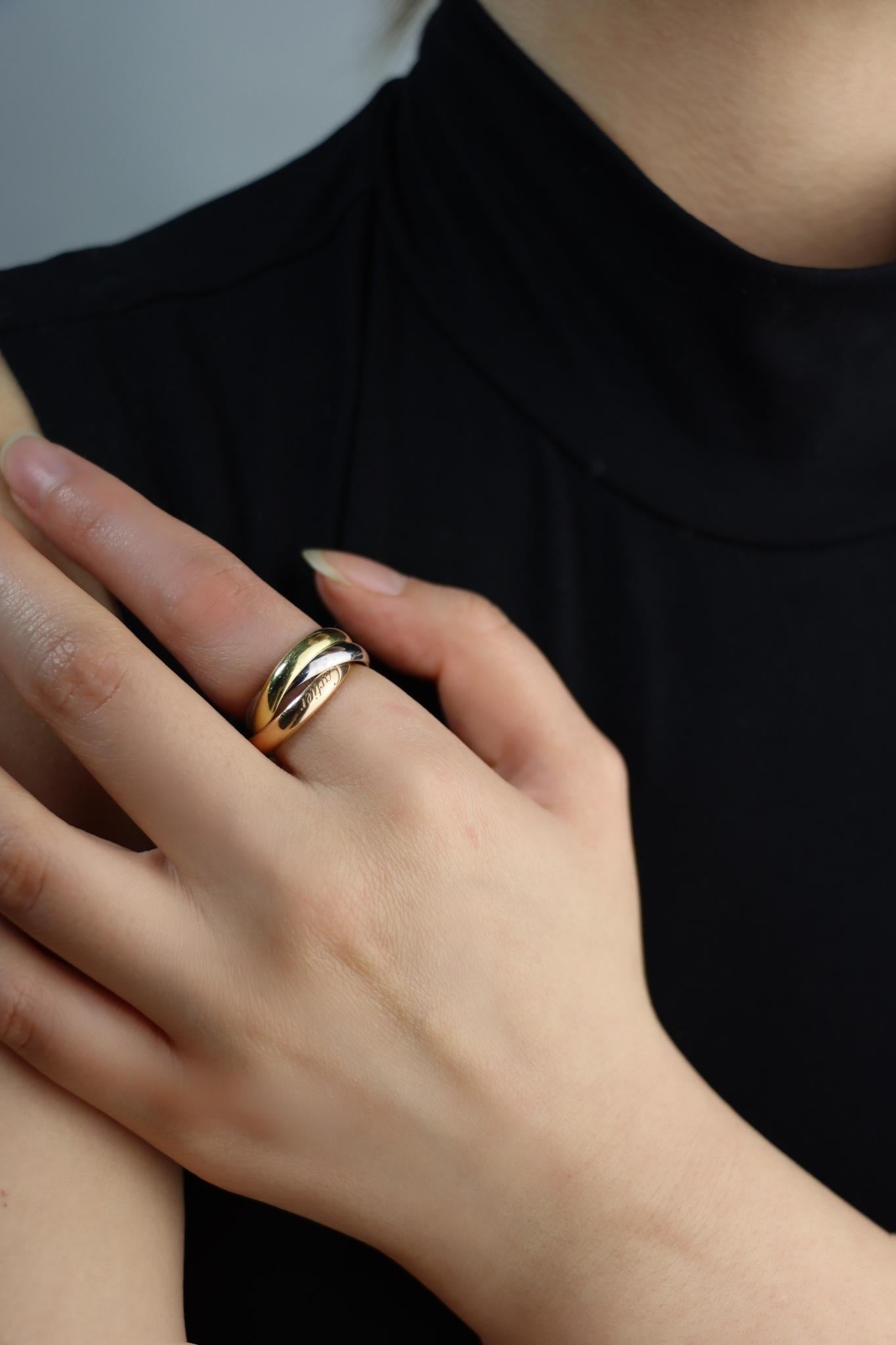 Cartier 18K Gold Trinity Ring

Marked:
Au750
Cartier

Approximate Dimensions: 
6 (Ring Size) 
0.8 cm (Width)
8.3 grams in weight.