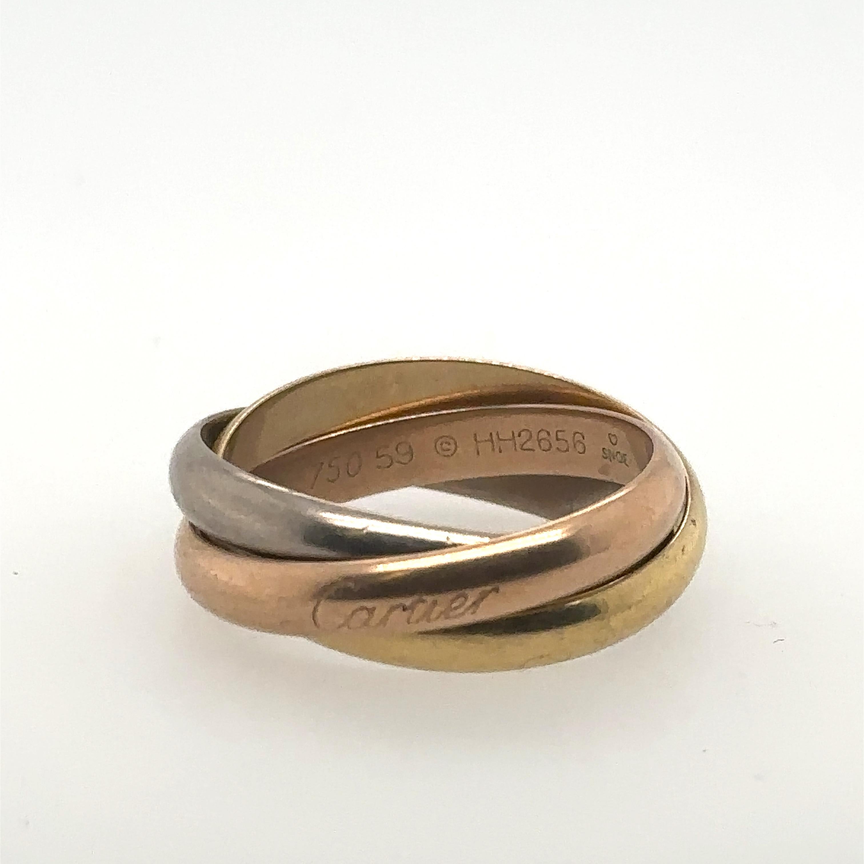 Cartier: 18 Karat Gold Trinity-Ring mit Echtheitszertifikat im Angebot 1
