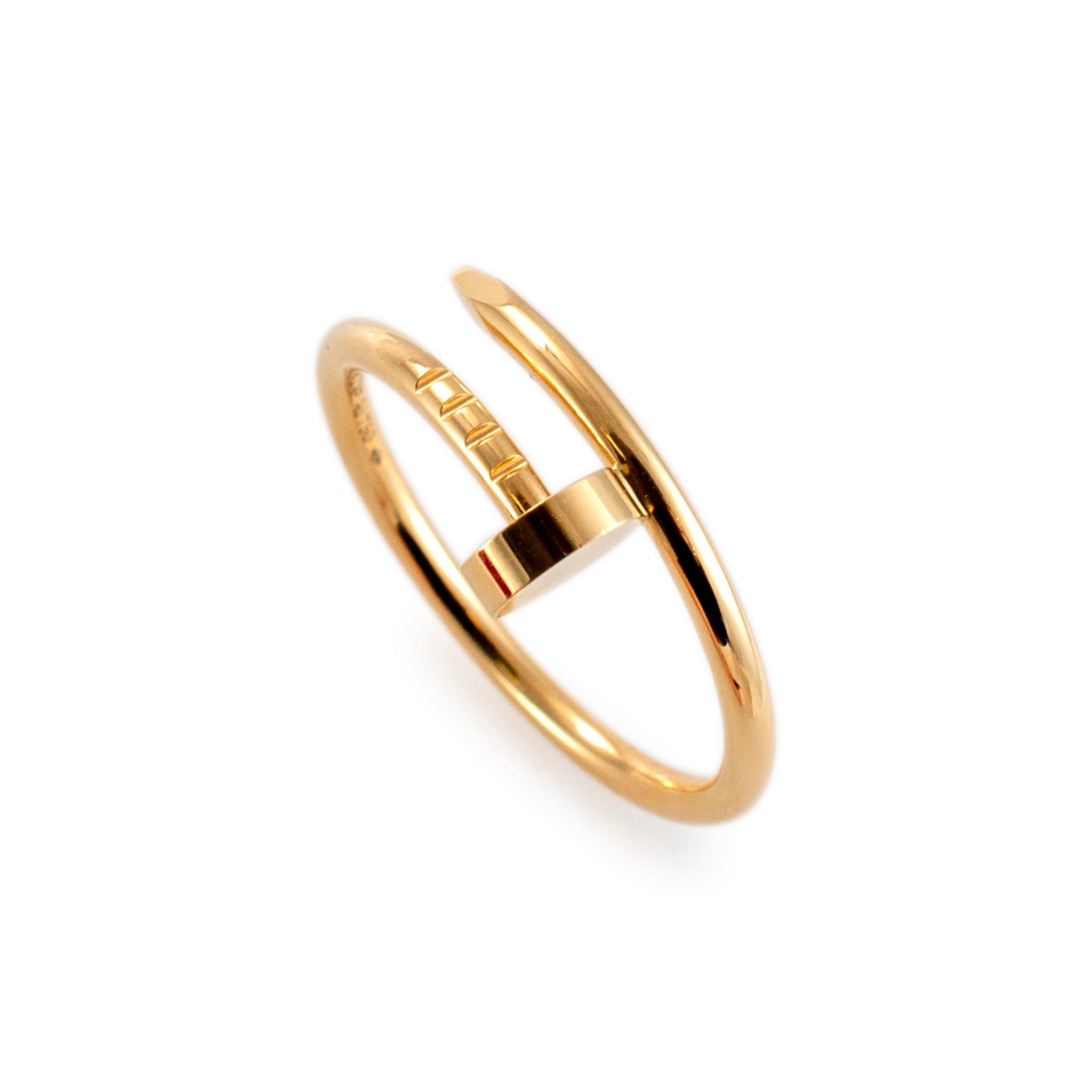 Brand: Cartier

Gender: Ladies

Metal Type: 18K Yellow Gold

Ring Size: 7.75

Width: 1.80 mm

Weight: 3.55 grams

18K Yellow Gold nail ring with a half round shank. The metal was tested and determined to be 18K yellow gold. Engraved with 