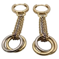 Pendientes largos de gota Cartier de oro multitono de 18 quilates