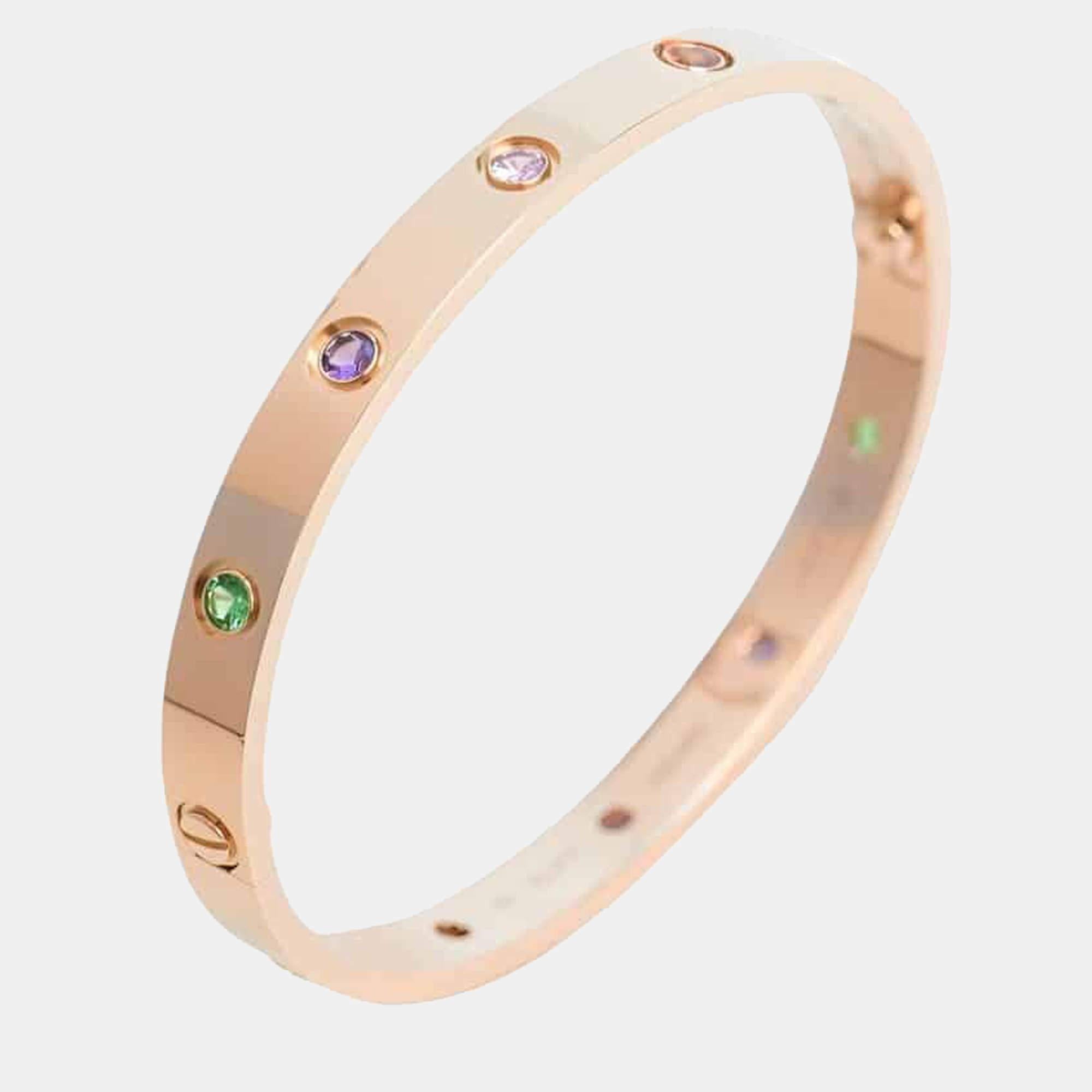 The 18k rose gold 10 multi-gem set Love bangle bracelet by Cartier is a true testament to the brand's exquisite craftsmanship and iconic design. 

This stunning bangle is adorned with a vibrant array of gemstones, including yellow and pink