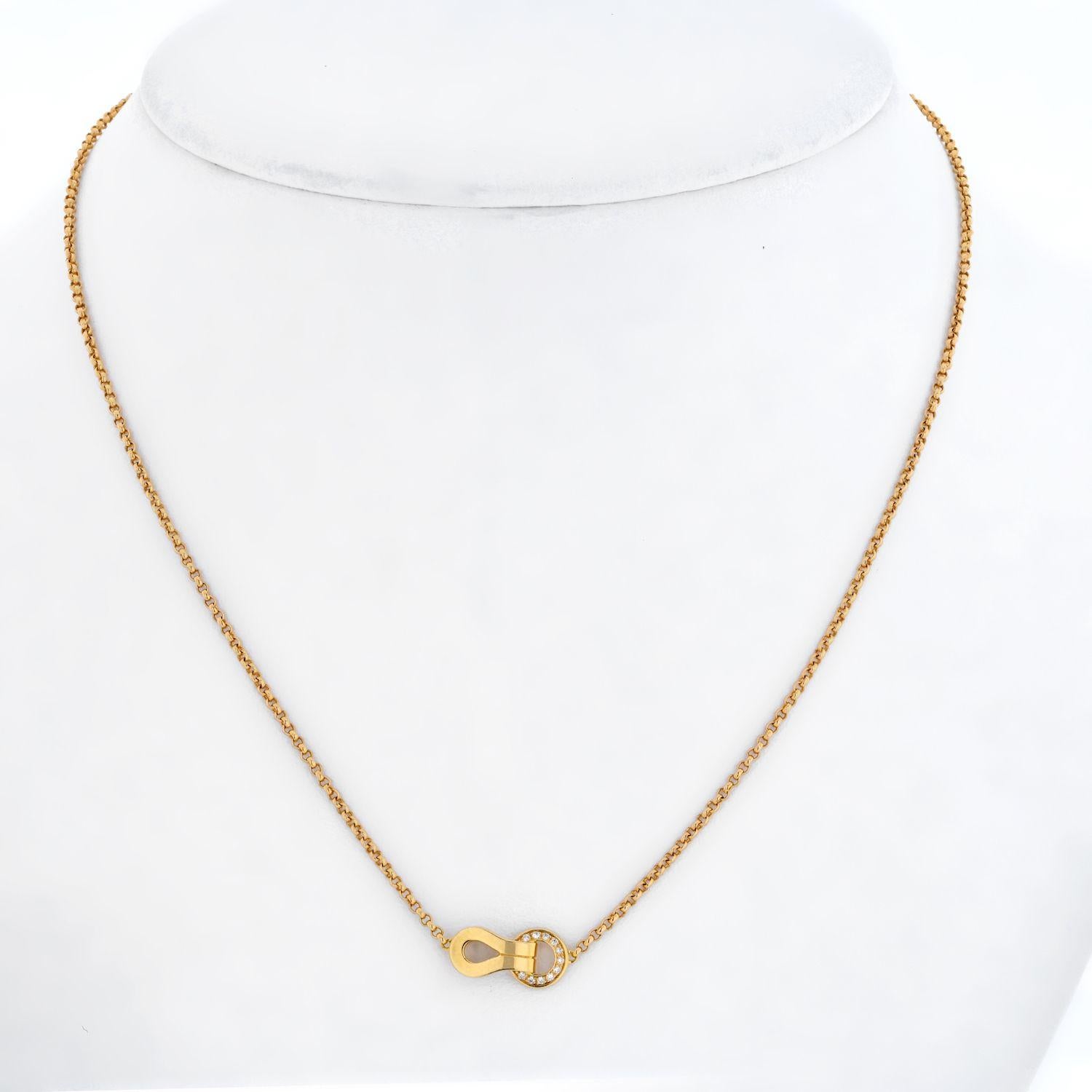 This elegant necklace is by Cartier, it is crafted from 18k rose gold with a polished finish. The pendant features a loop interlock with a diamond decorated circle, it is attached to a classic rolo link chain and is signed by the designer with the