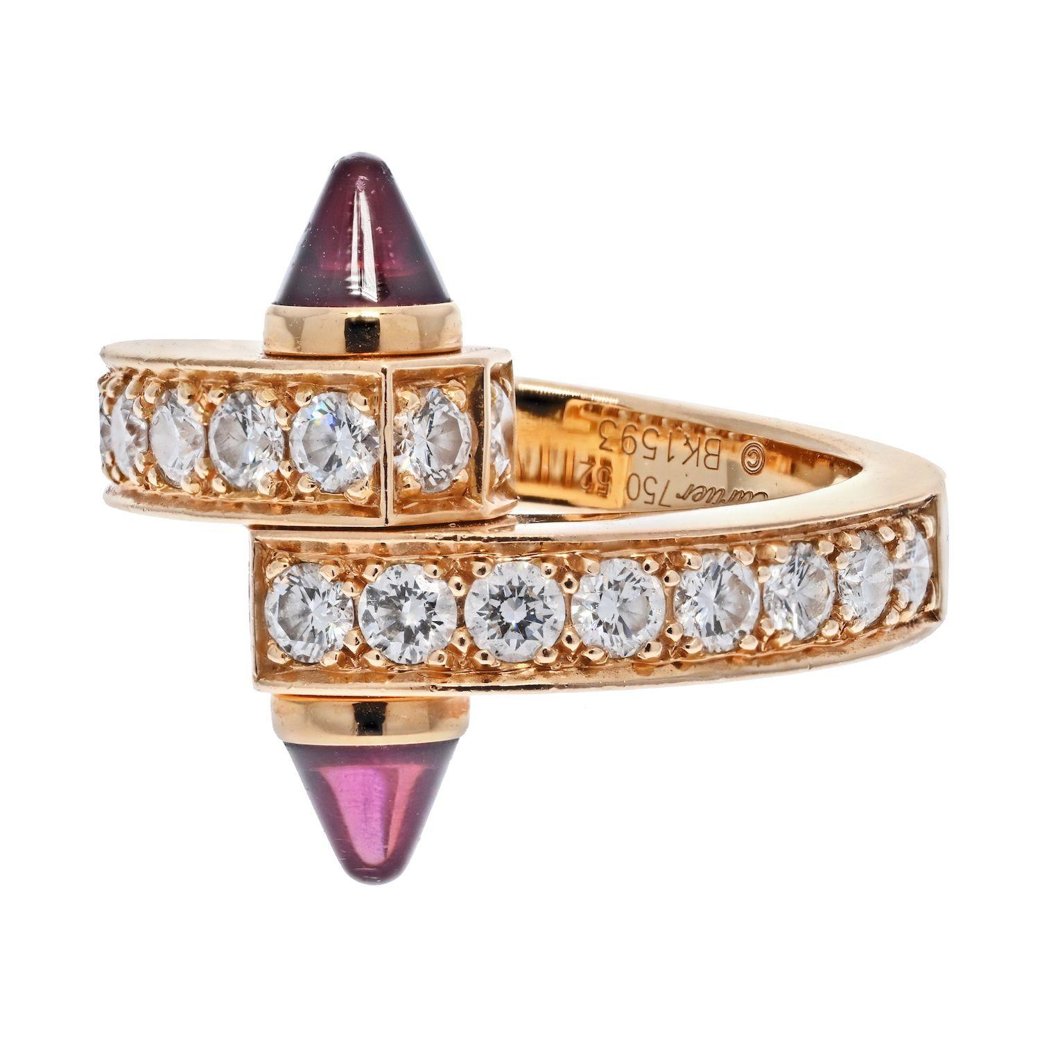 Cartier Menotte 18K Rose Gold Diamond and Garnet Ring. 
Bypass diamond ring from the Cartier Menotte Collection. Signed and numbered Cartier 750. Size 6. Designed as a screw motif set with round brilliant cut diamond accented by cabochon garnet