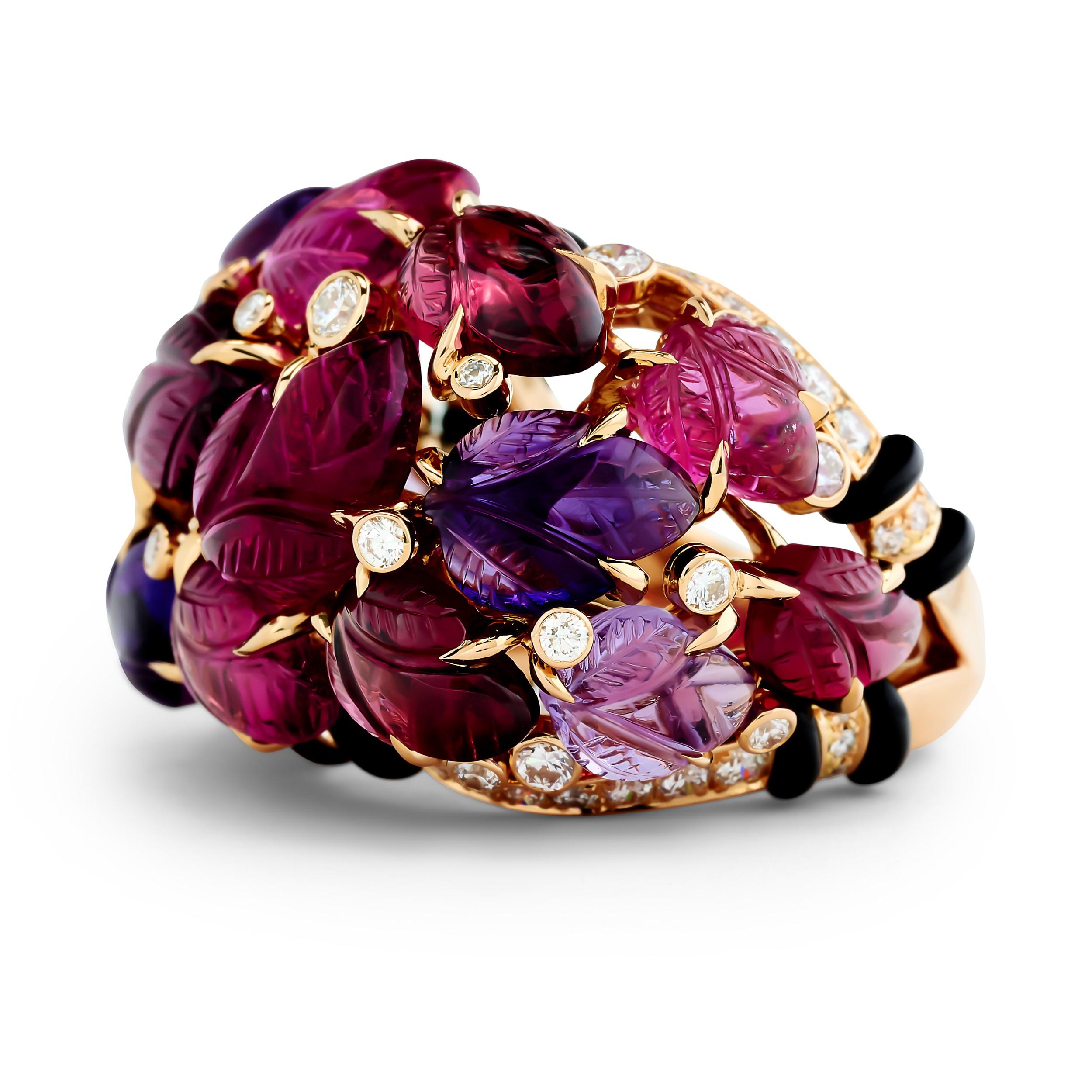 A Cartier masterpiece featuring a vibrant carved rubellite and amethyst leaves, both accented by shimmering diamonds and onyx, all set in exquisite gold.

Size 53
Numbered and signed Cartier.
