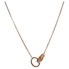 Cartier, collana con ciondolo Baby Love in oro rosa 18 carati e mezzo pavé di diamanti