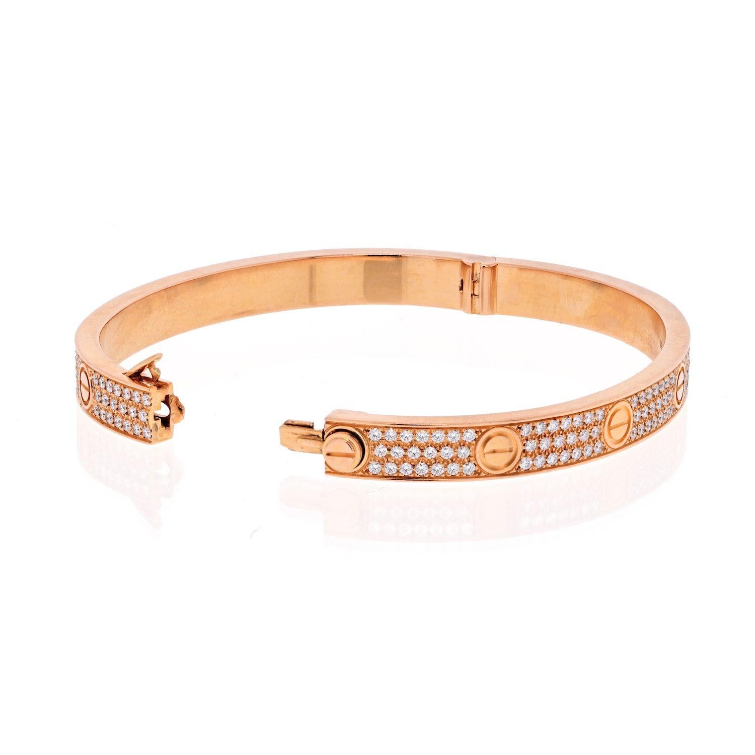 Cartier 18K Rose Gold Pave Love Bangle Size 19 Bracelet.
The bracelet is crafted of 18 karat rose gold and features the signature engraved LOVE motif centered between pave set round brilliant cut diamonds, approximately 3.40 total carat weight.