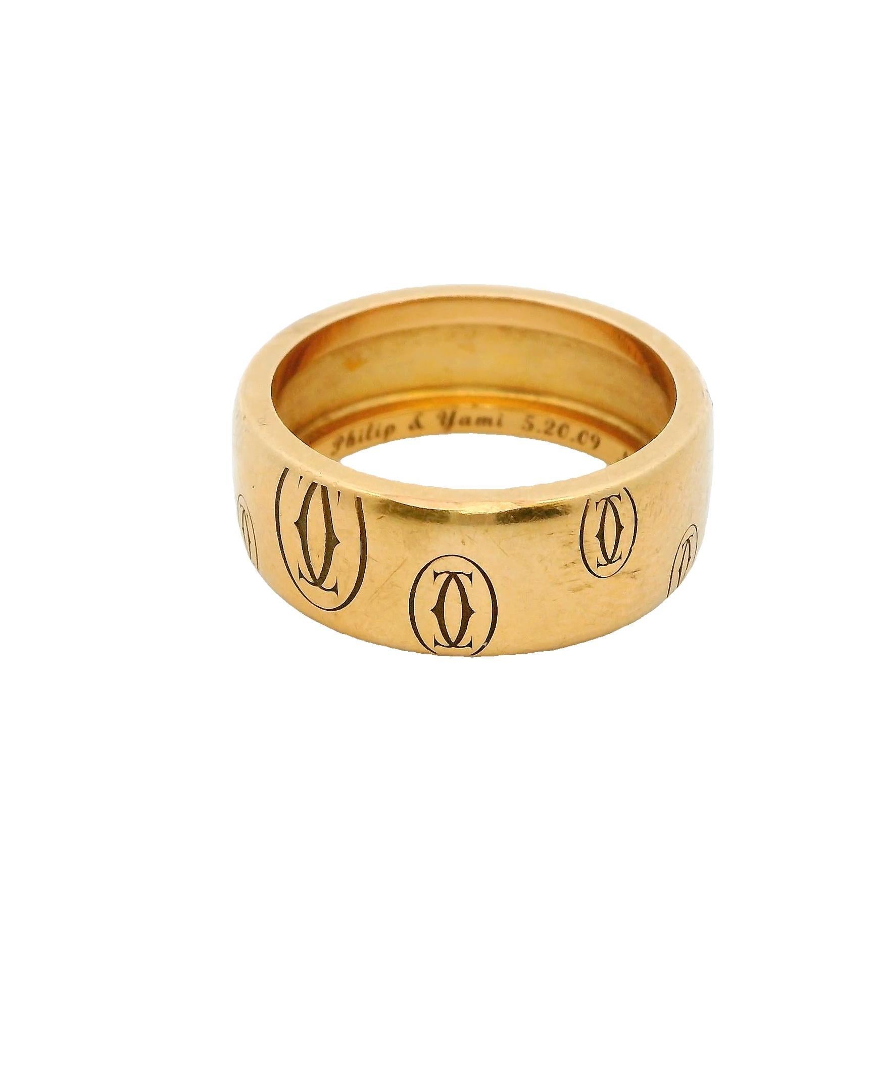 This elegant ring is crafted in 18k rose gold. It features a repeating motif of interlocking ovals engraved around the band.

The ring is designed by Cartier, showcasing their signature style.

Total weight is 9.8 grams.

Ring size 8.

C. 21st