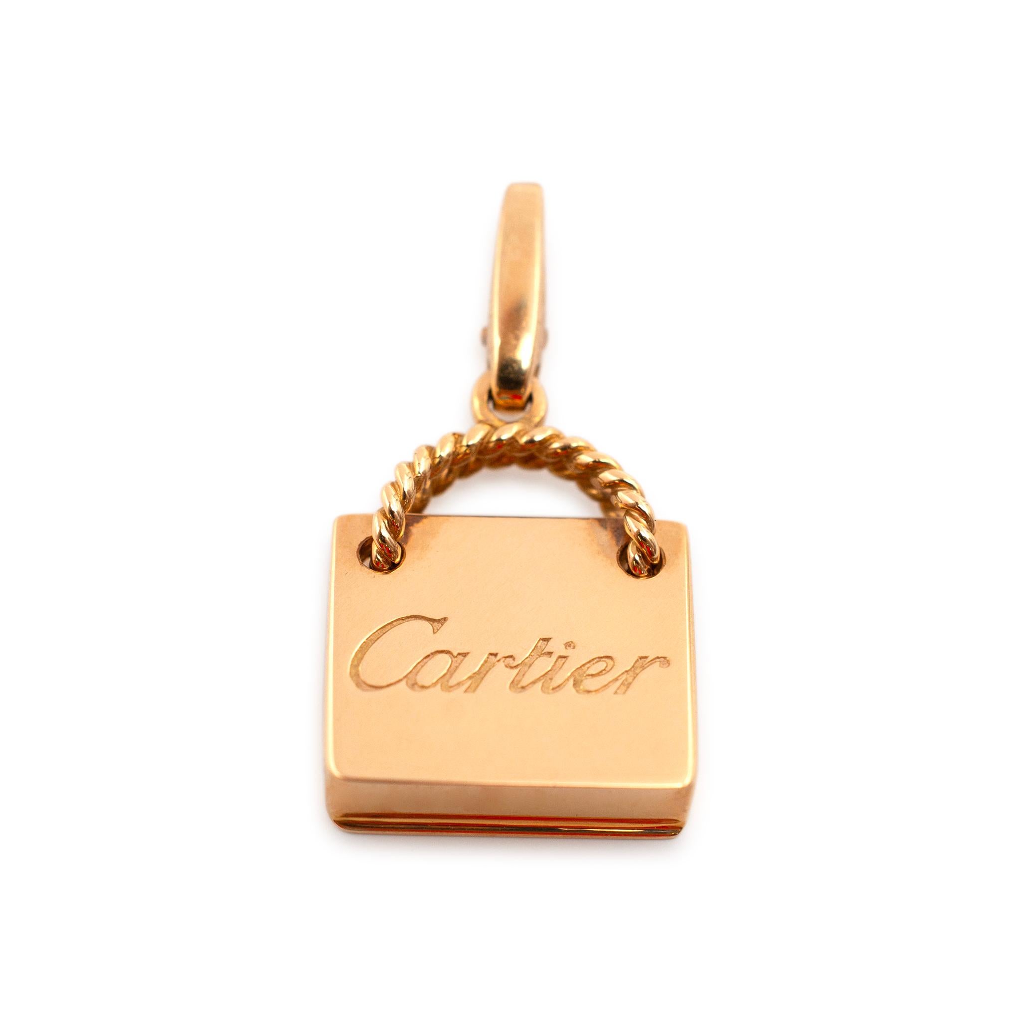 Brand: Cartier

Gender: Ladies

Metal Type: 18K Rose Gold

Length: 1.00 Inches

Width: 14.50 mm 

Weight: 4.69 grams

Ladies designer made polished 18K rose gold, contemporary-style charm. Engraved with 