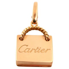 Cartier, breloque de sac shopping en or rose 18 carats