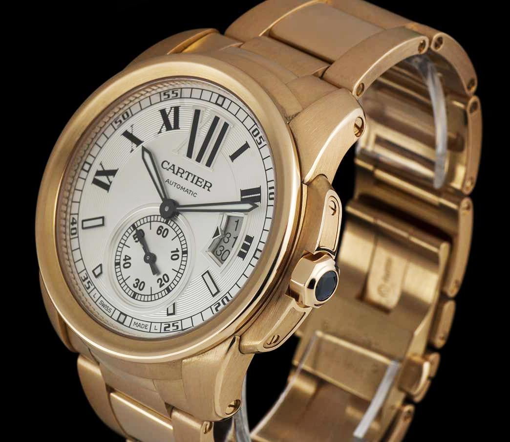 An 18k Rose Gold Calibre De Cartier Gents 42mm Wristwatch, silver dial with half roman numerals and half applied hour markers, three day date display at 3 0'clock, small seconds at 6 0'clock, minute rail-track on outer edge of the dial, sword shaped
