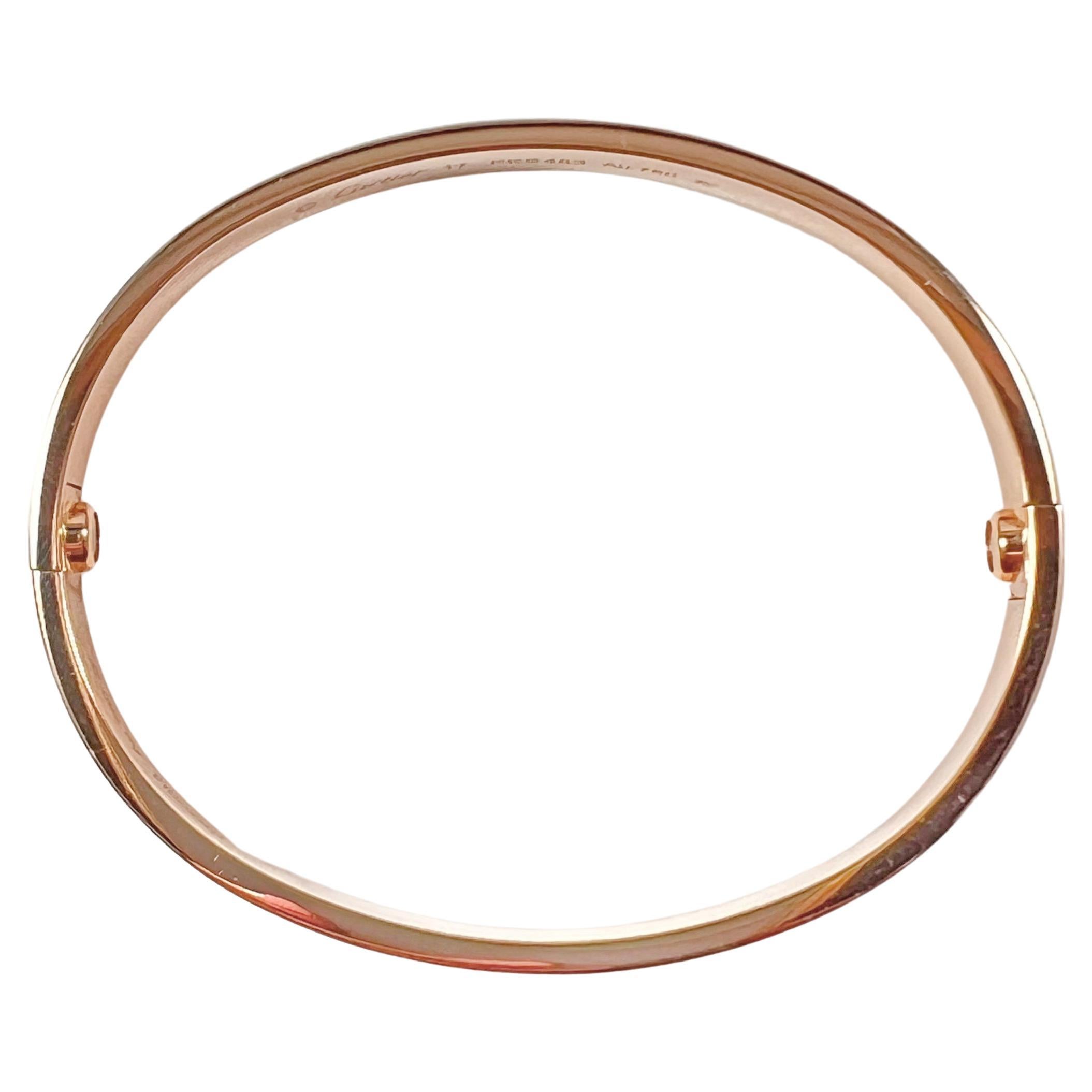 Cartier Love bangle bracelet in polished 18k rose gold, featuring the newer-style screw system.  Size 17.  Accompanied by the original signed Cartier screwdriver, as well as inner fitted box, outer red box, as well as Cartier certificate in the