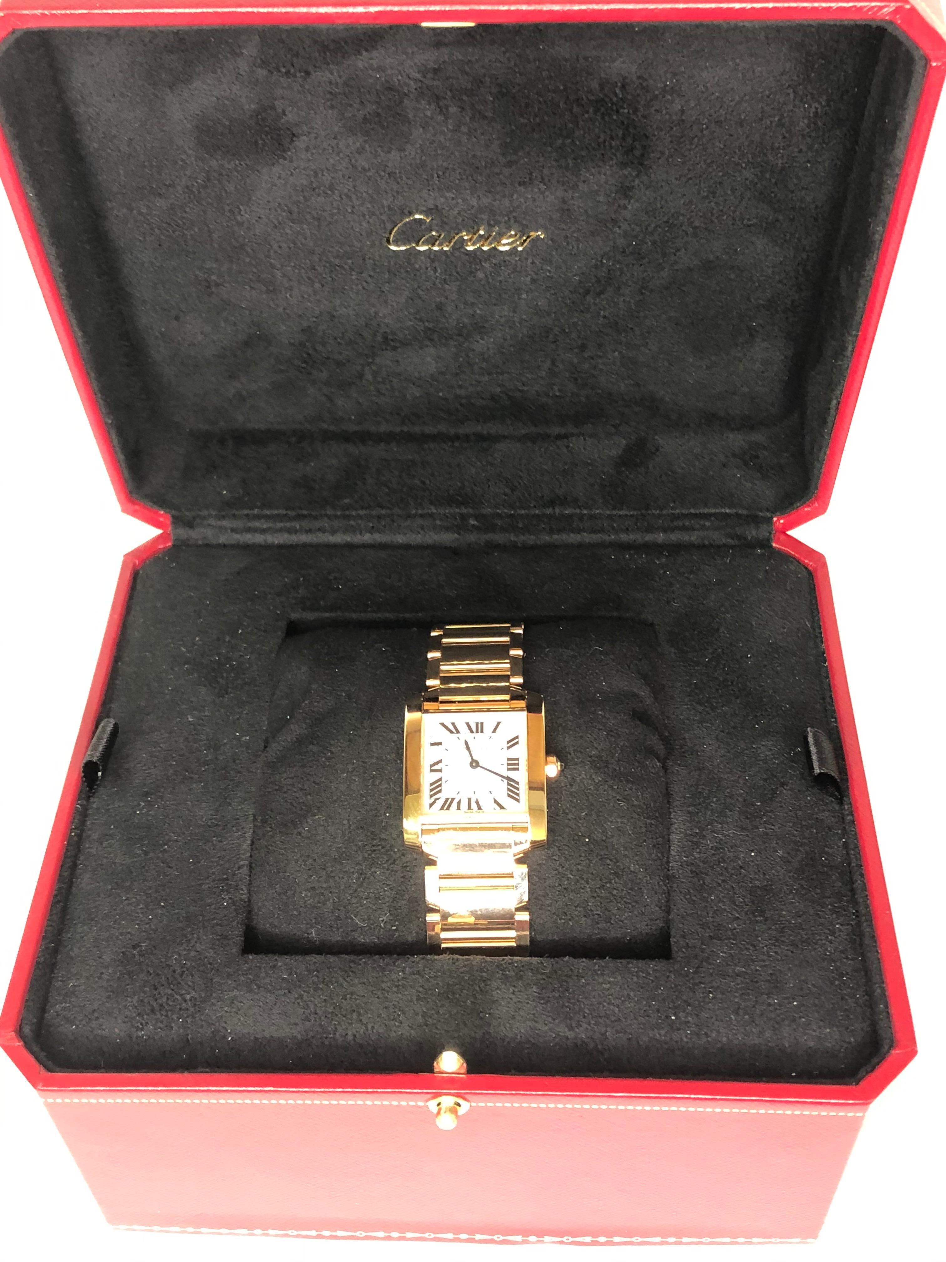 Cartier Watch Rose Gold Watch
Collection:  Tank Francaise
Size: Medium
Ref: WGTA0030
Previously owned but never worn.
18 karat rose gold.
Mother of pearl square face.
Three links that were removed are included.  Watch has never been worn.
Comes with