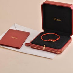 Cartier Bracelet en cordon de soie rouge Trinity 18 carats