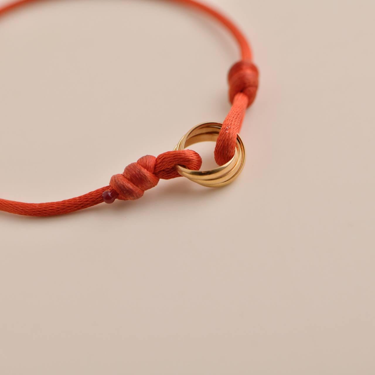 Cartier 18K Rose Gold Trinity Red Silk Cord Bracelet In Excellent Condition In Banbury, GB