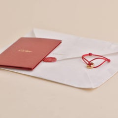 Cartier Bracelet en cordon de soie rouge Trinity 18 carats