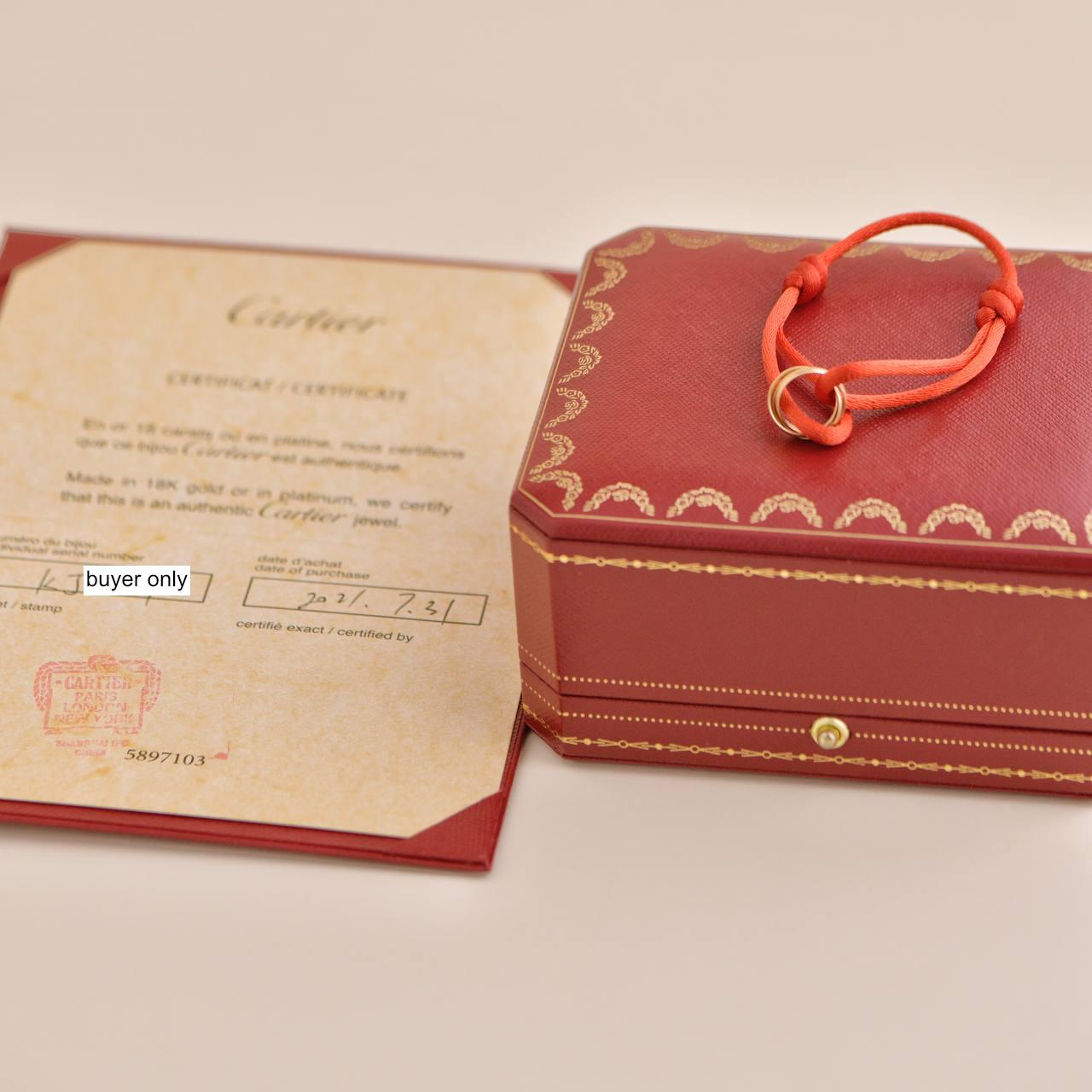 *Rare Find*

Introducing the Cartier Trinity 18K Rose Gold Red Silk Cord Bracelet, a rare find from 2021. This exquisite piece, weighing 2.78 grams, features Cartier's iconic Trinity design crafted in 18K rose gold. 

SKU	 AT-2557
Comes With	Full