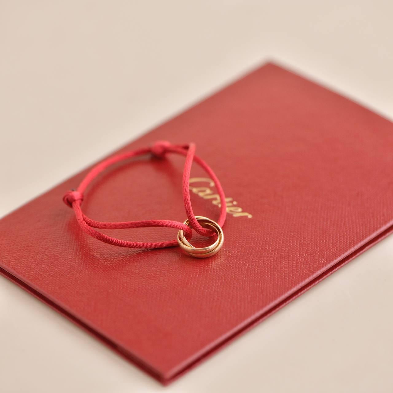 Cartier 18K Rose Gold Trinity Red Silk Cord Bracelet In Excellent Condition For Sale In Banbury, GB