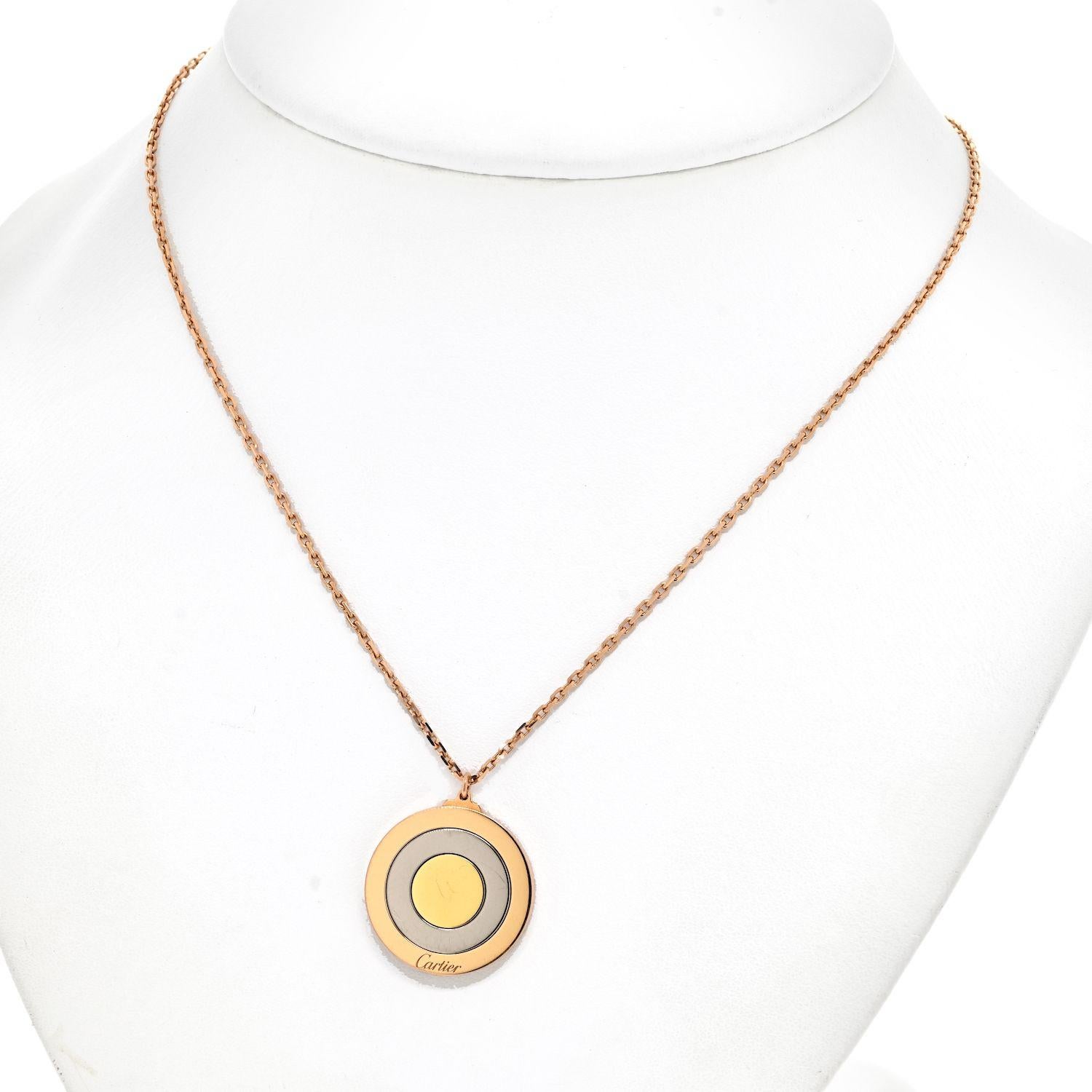 Presenting an exquisite spinning pendant crafted in 18k rose gold by Cartier. The pendant showcases a captivating trio of circular discs that elegantly graduate in size. Alternating between outer discs of 18k rose gold and inner discs of 18k white