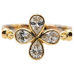 Anillo Cartier Flor de Diamantes en Oro Tricolor de 18k con Cuatro Diamantes Brillantes