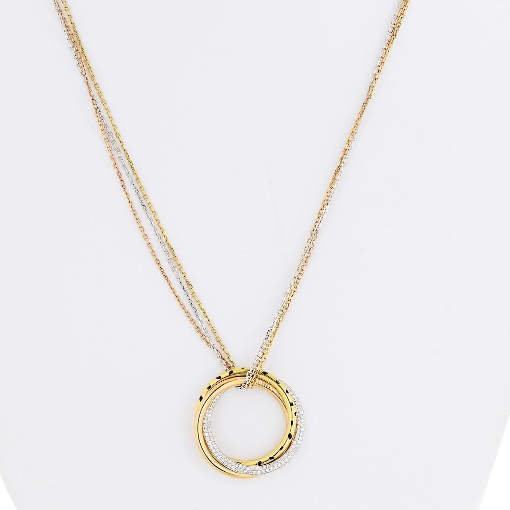 18k white, yellow and pink gold Cartier pendant  necklace from the trinity collection. This piece is featuring interlocking tricolor rings embellished with black lacquer accented with round brilliant cut diamonds totaling aprox. 0.88cts in total.