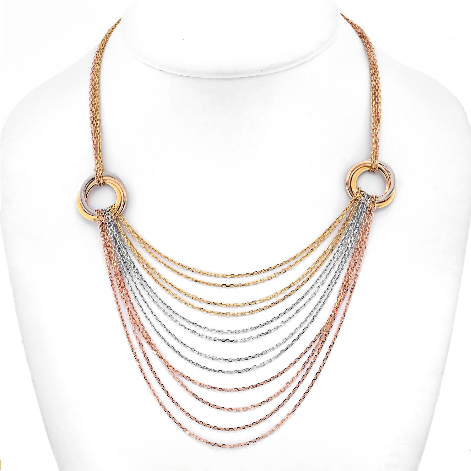 18K white, yellow and rose gold Cartier Trinity de Cartier draped chain necklace featuring two interlocking Trinity stations, twelve box chain draped strands, multistrand box chain and box clasp closure. Includes original box. 

Necklace length: 16