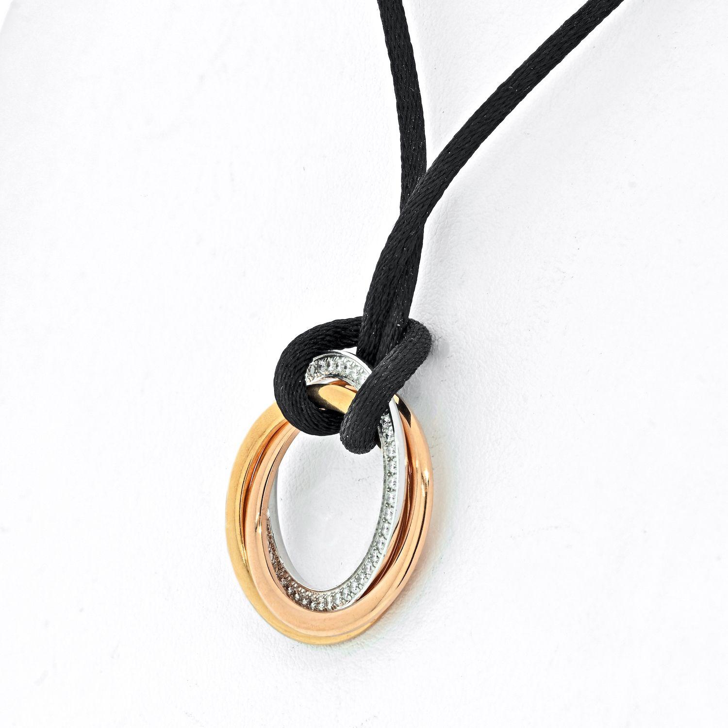 black cord necklace with gold pendant