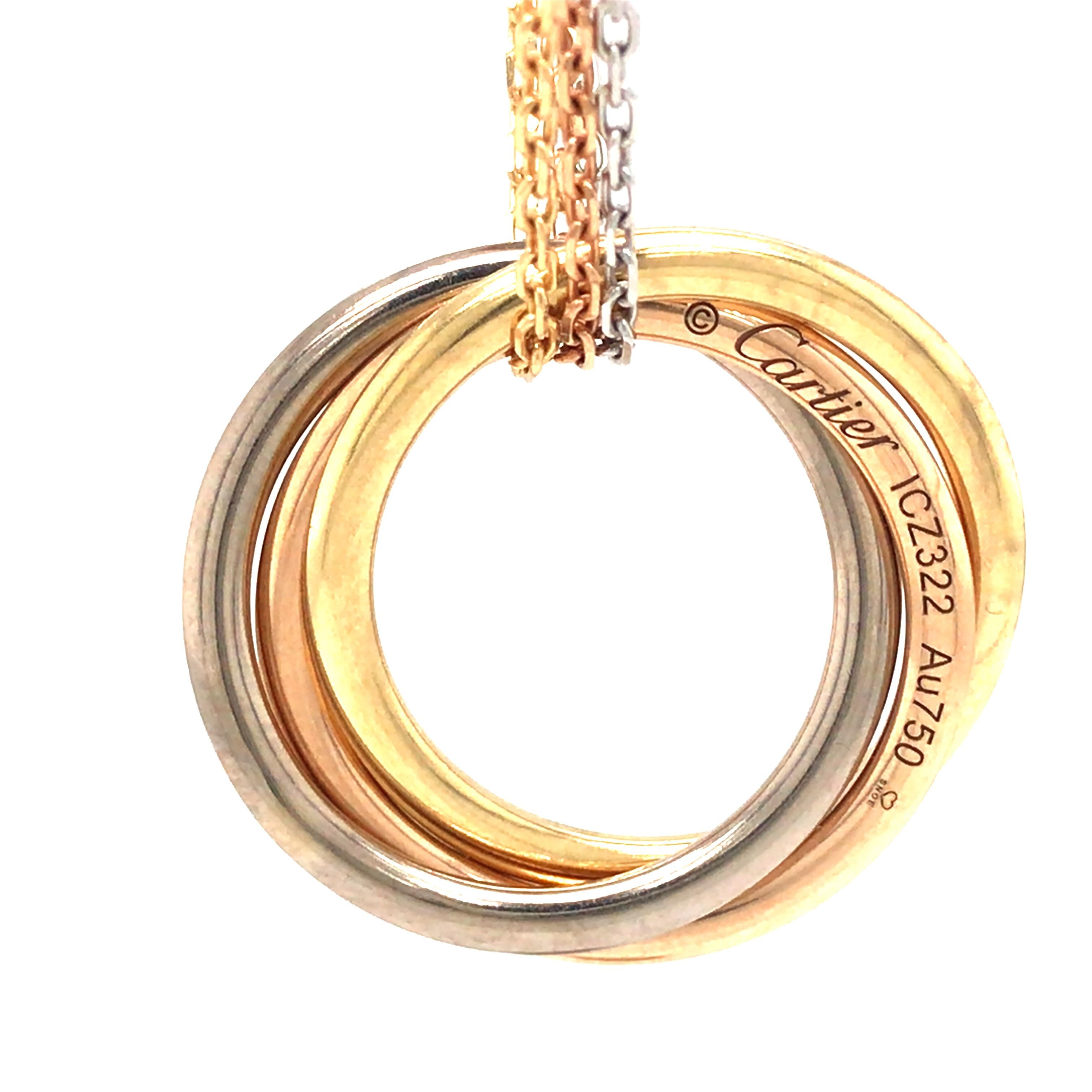 Cartier 18K Tri-Gold Trinity Pendant Necklace.  The Chain measures 35 inch in length.  The Trinity Pendant measures 1 inch in diameter.  27.68 grams.  Pendant stamped 