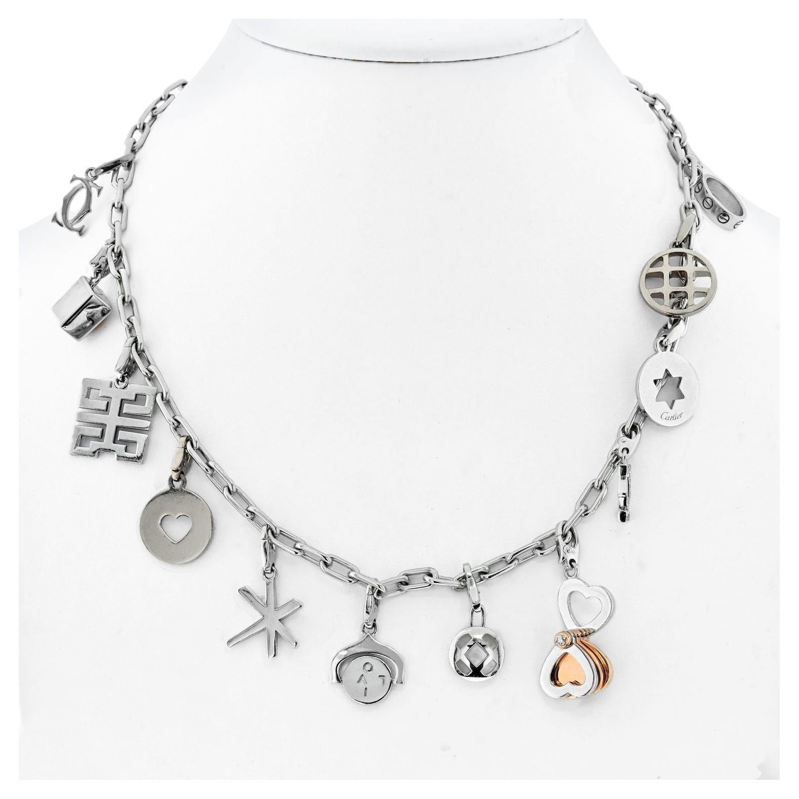 This 18K white gold chain link Santos necklace from Cartier has 12 delightful charms spaced around it's length. 
The lobster clasp is hallmarked and the 4.8-millimeter chain can be worn all by itself with the charms removed if you like or if the