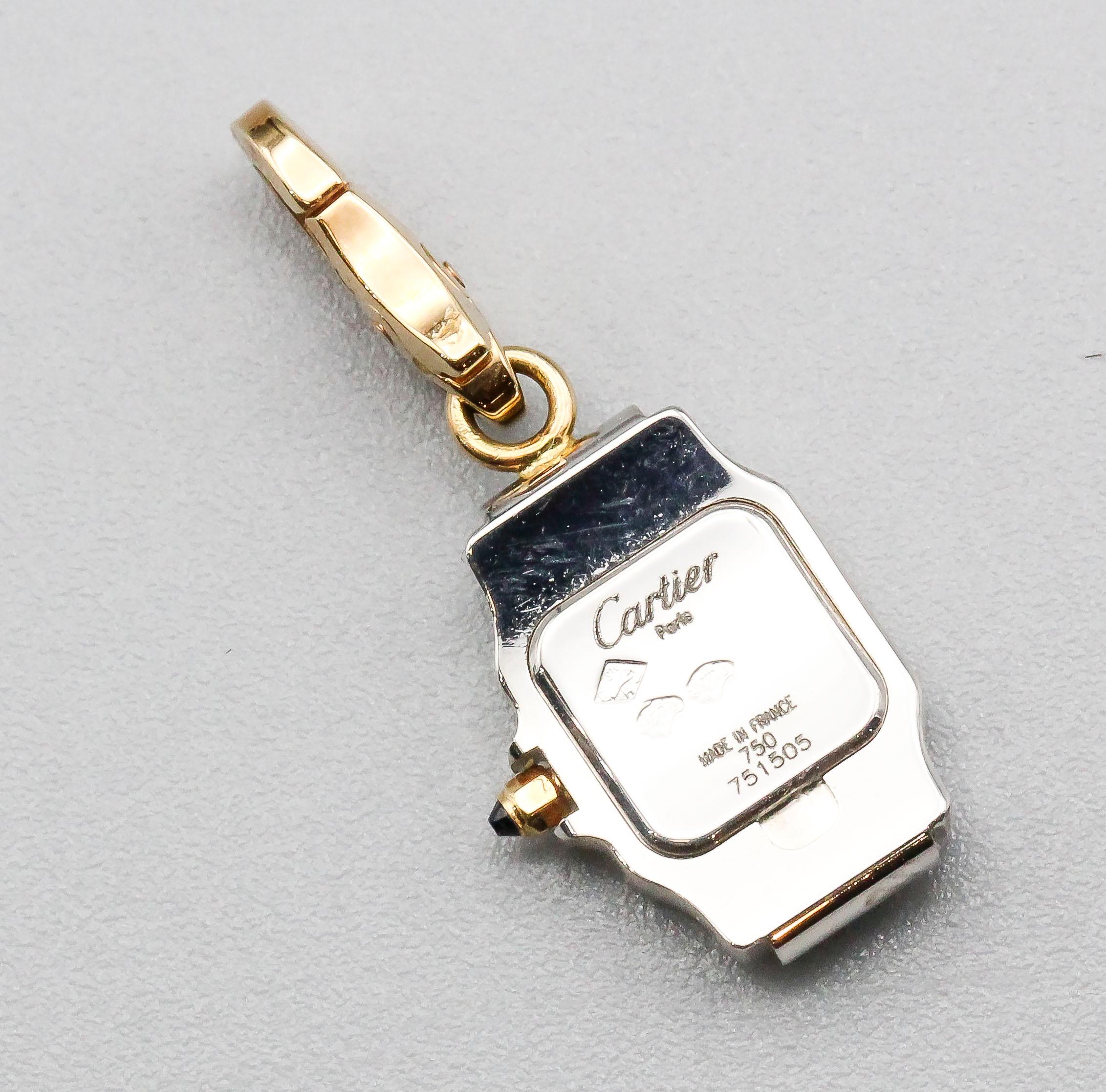 Fine and rare 18k two-tone gold watch charm in the likeness of the Santos model, by Cartier.

Hallmarks: Cartier, 750, reference numbers, 42/70, French 18K gold assay mark.